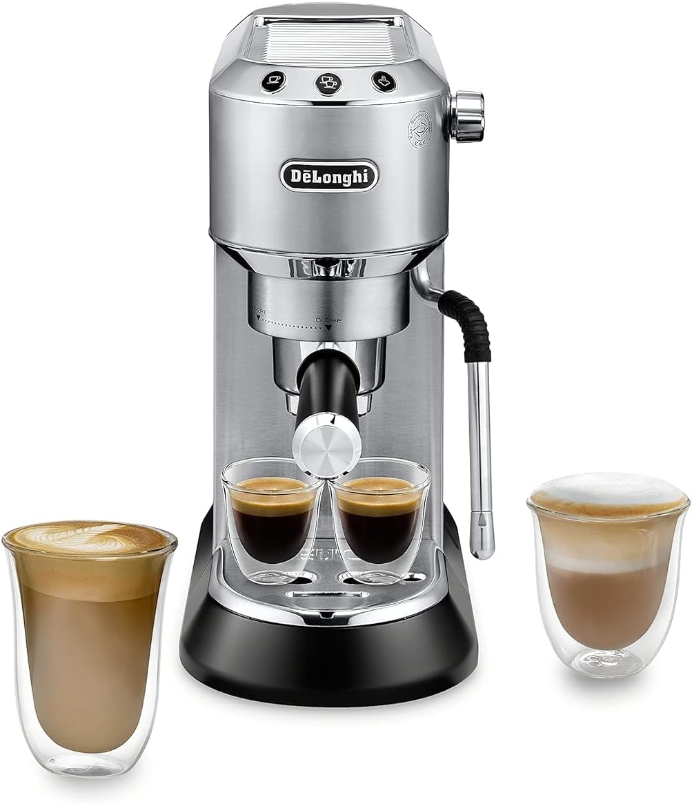 Stainless espresso machine with two filled shot glasses and two latte cups
