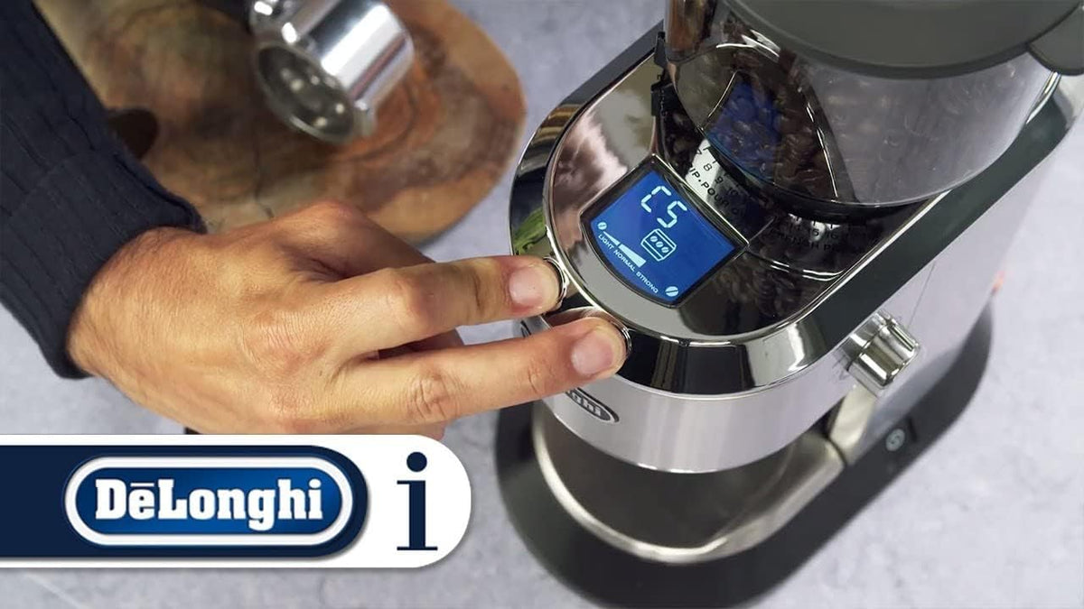 De'Longhi Dedica coffee grinder control panel with blue display, hand touching settings