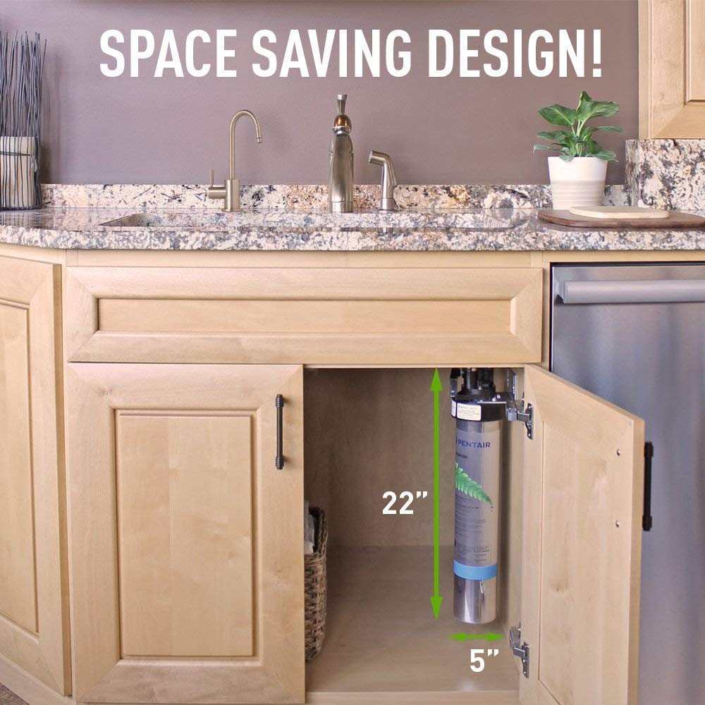 Undersink setup with installed water filter cartridge in cabinet