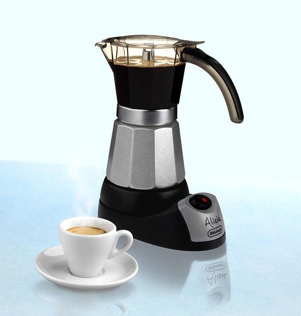 Moka espresso maker with cup and saucer, black base and metal frame