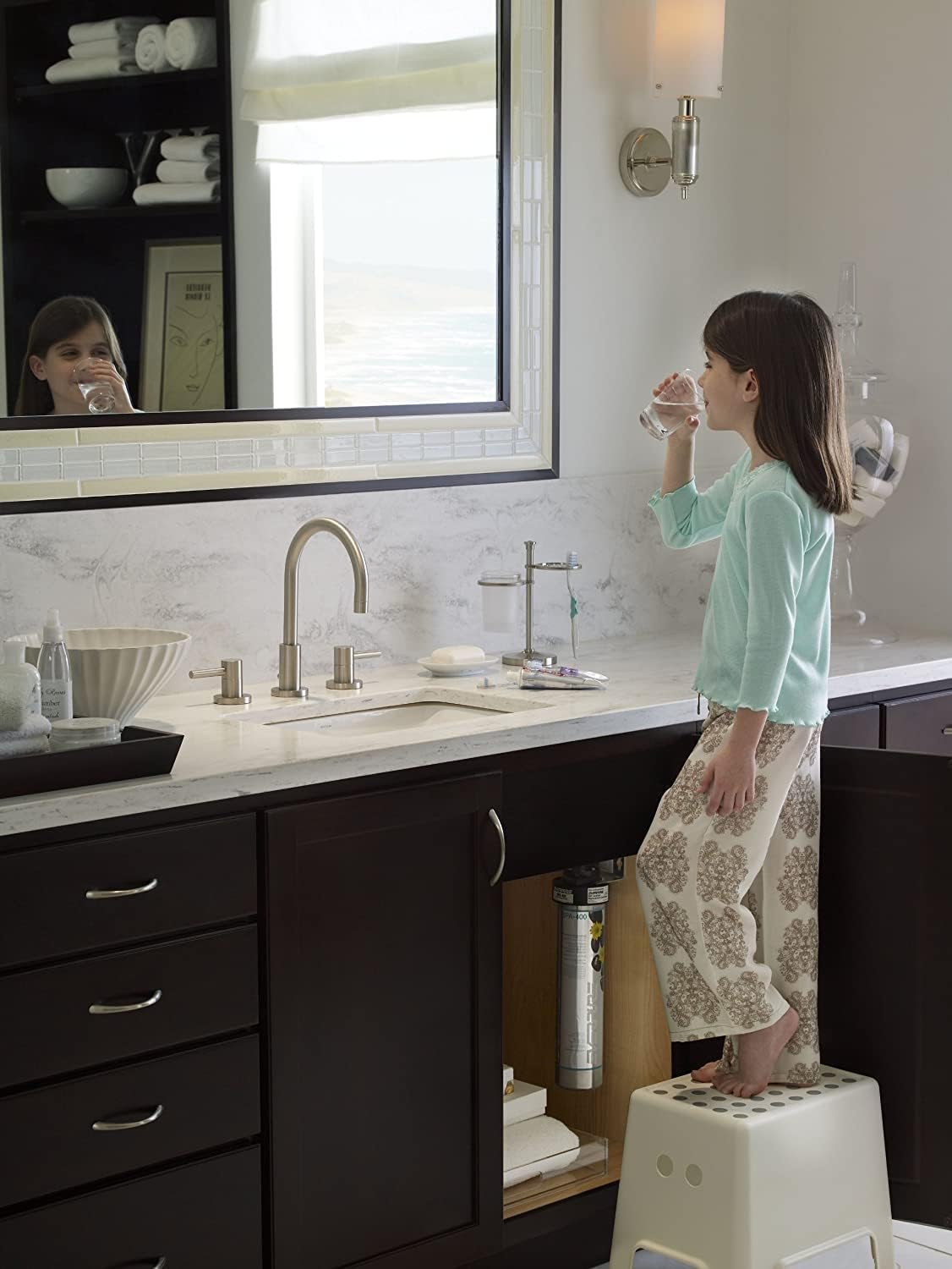 Under-sink water filter canister with quick-connect fittings