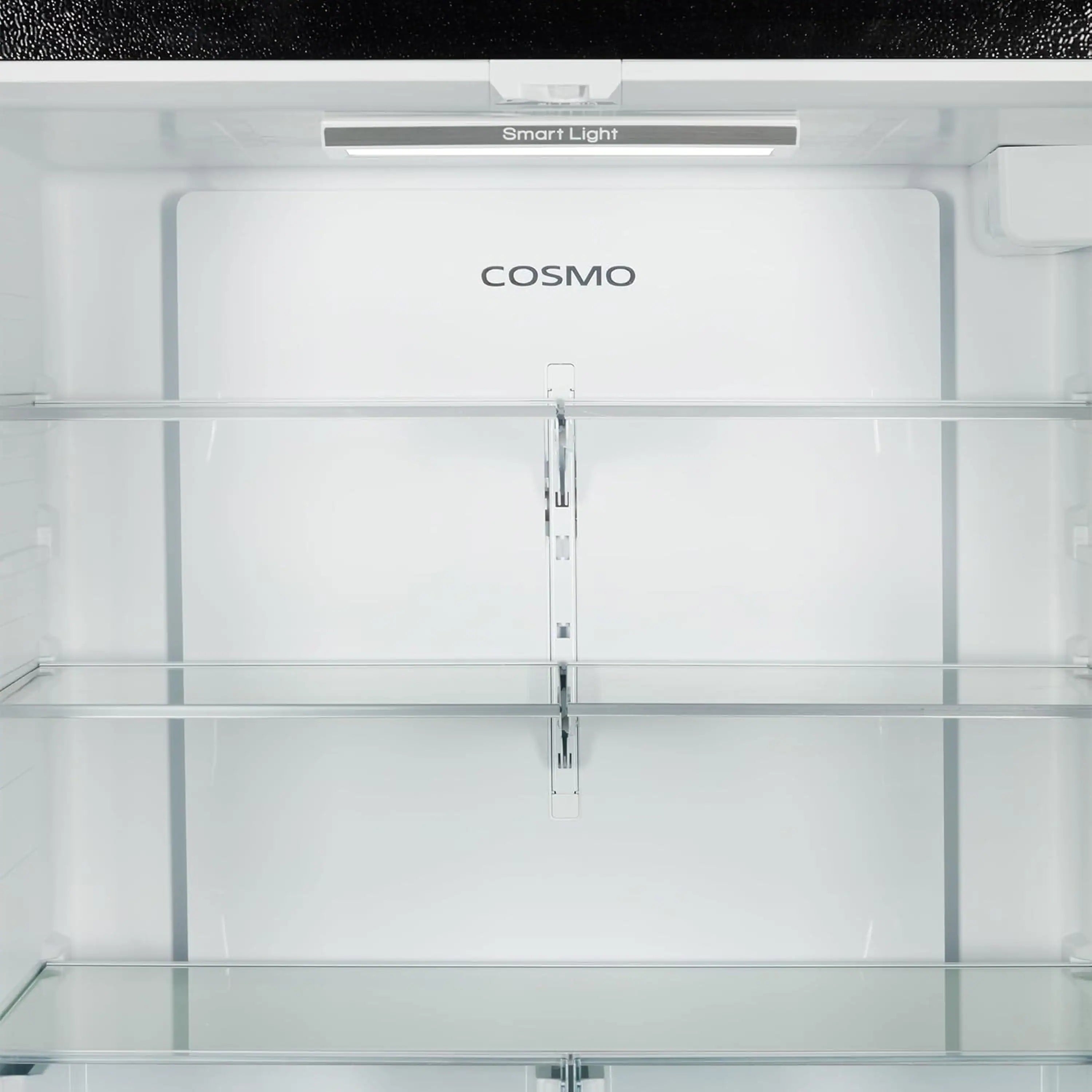 Refrigerator interior with glass shelves, crisper bins, and bright LED light