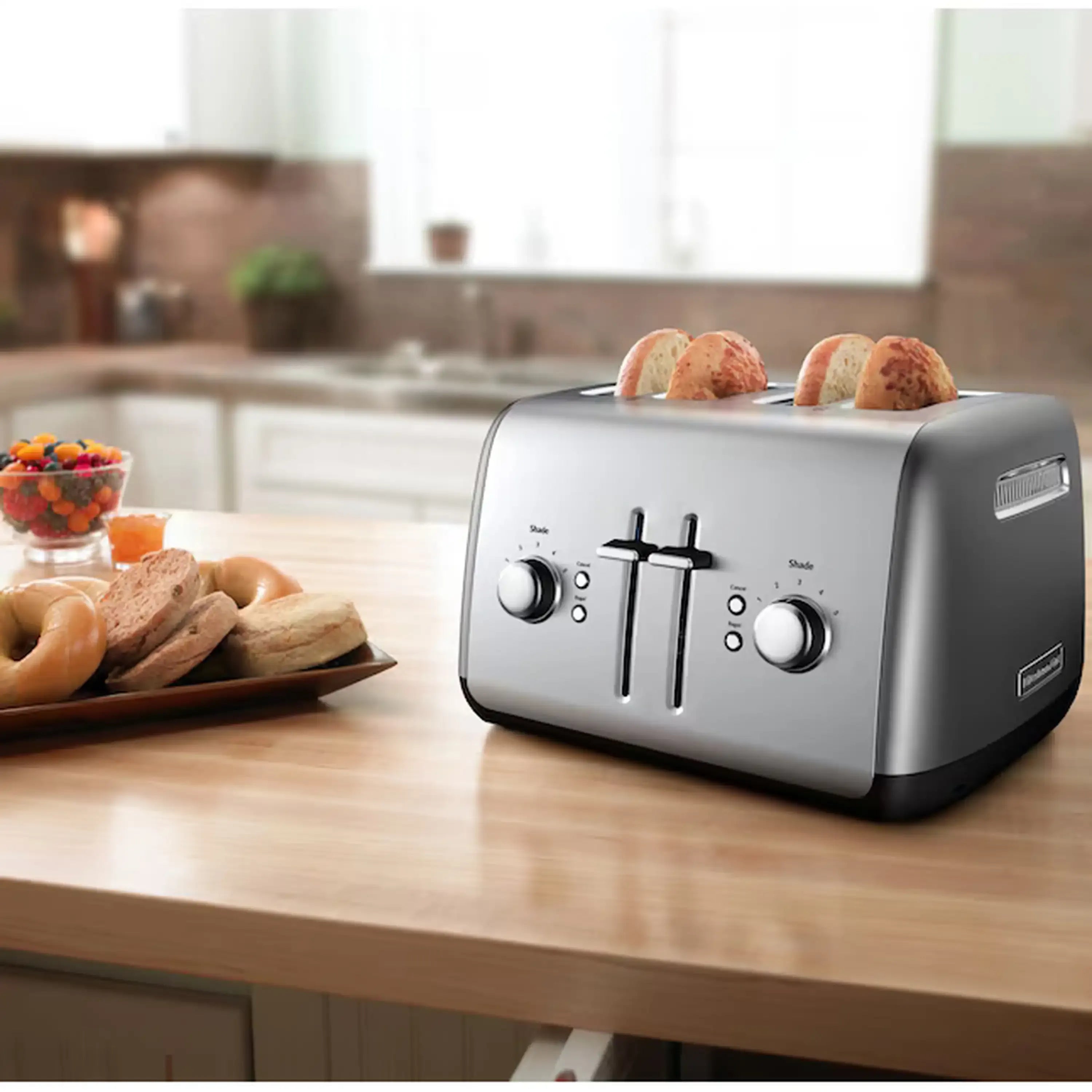 Contour Silver KitchenAid 4-slice toaster on a countertop with two bread slots and lift levers