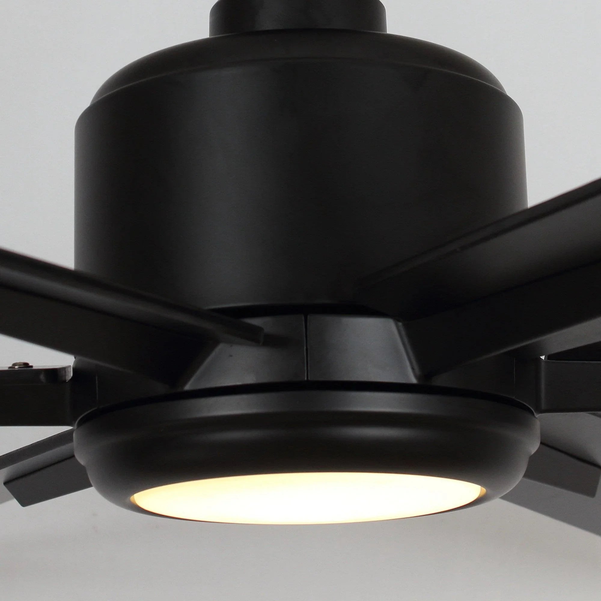 Black ceiling fan housing with integrated light panel beneath the blades