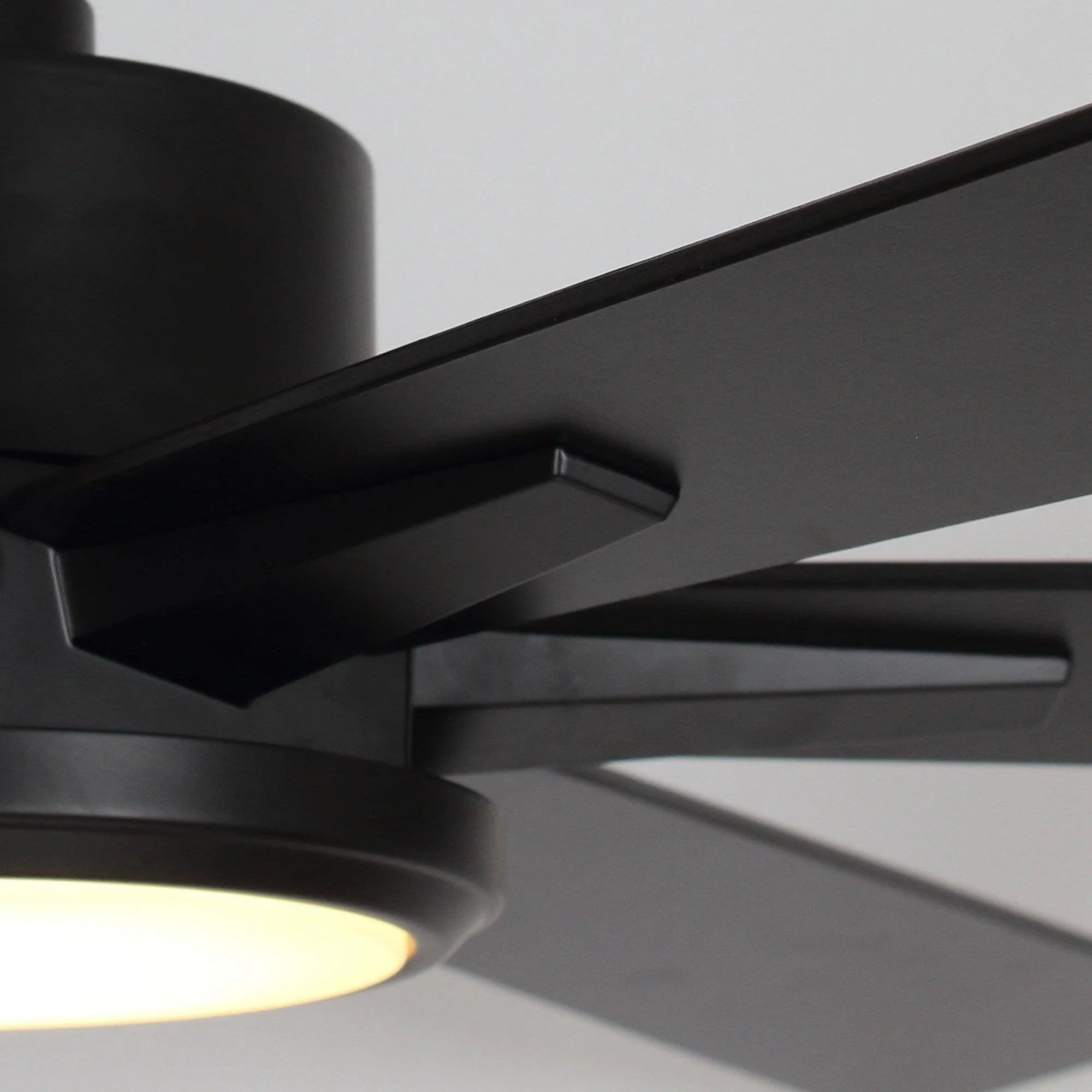 Black ceiling fan motor and blade arms with integrated light housing