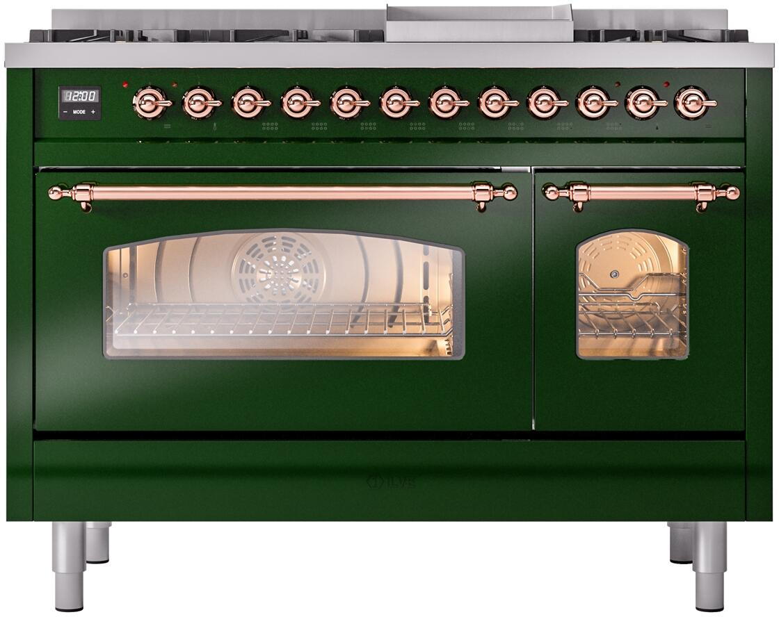 Emerald green range with oven door open, copper handles, and illuminated interior