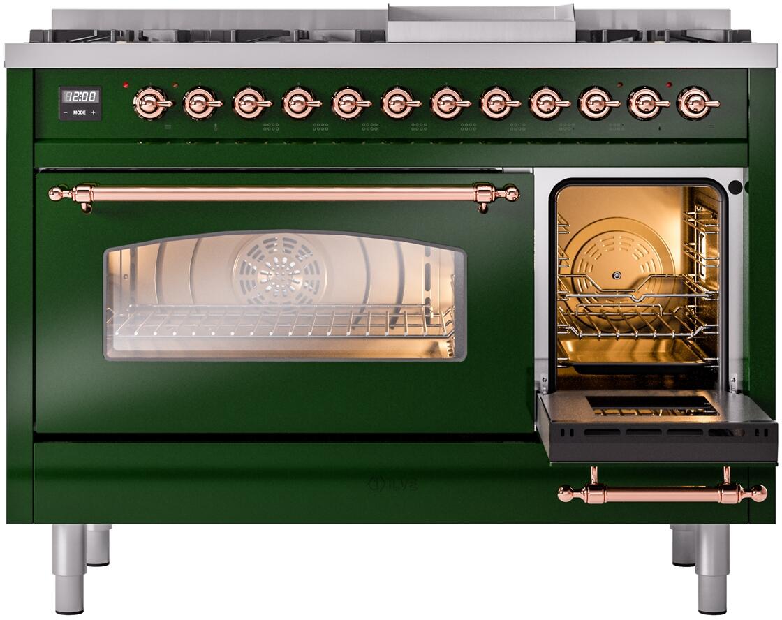 Emerald green dual fuel freestanding range with one oven door open, copper trim, and lit oven