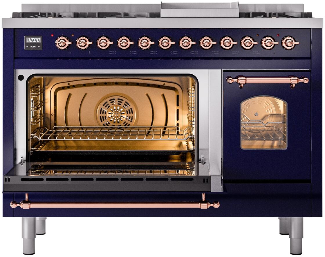 Freestanding dual fuel range with open main oven, interior racks, and copper accents.