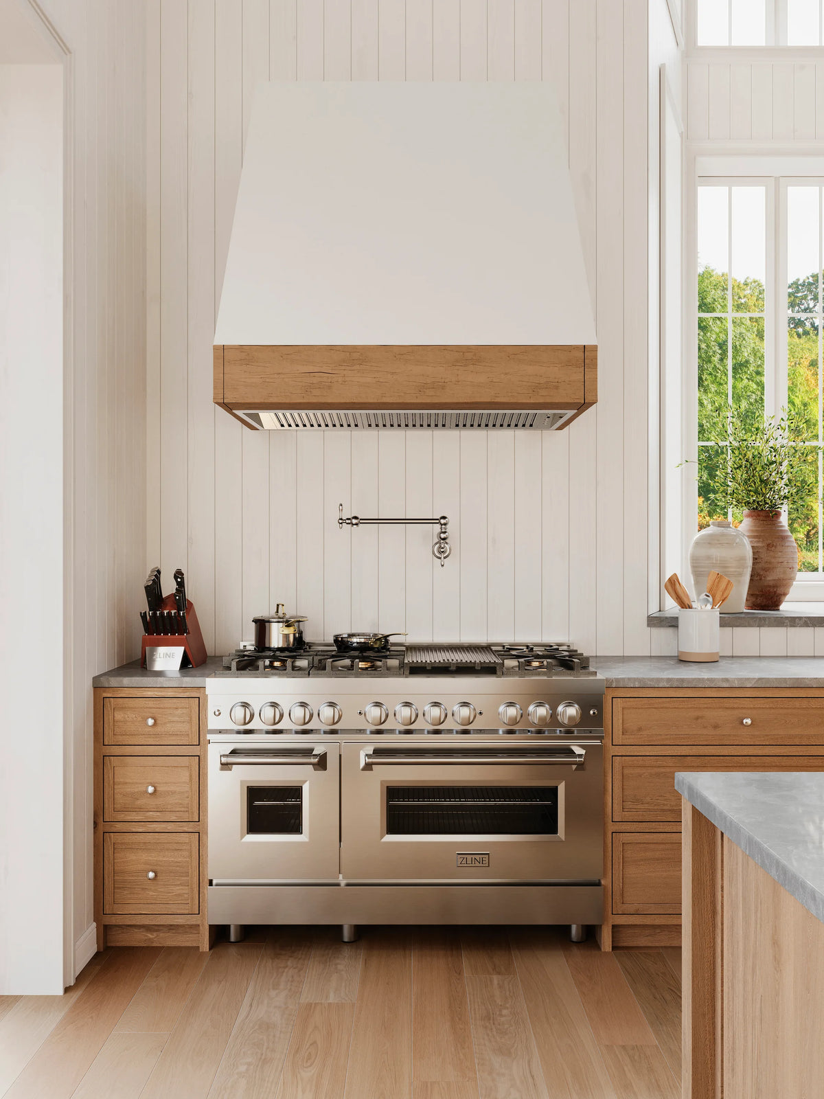 ZLINE 48-inch Legacy Series Dual Fuel Range with 7 Gas Brass Burners and 6.0 Cu. Ft. Electric Double Oven in Stainless Steel in a kitchen