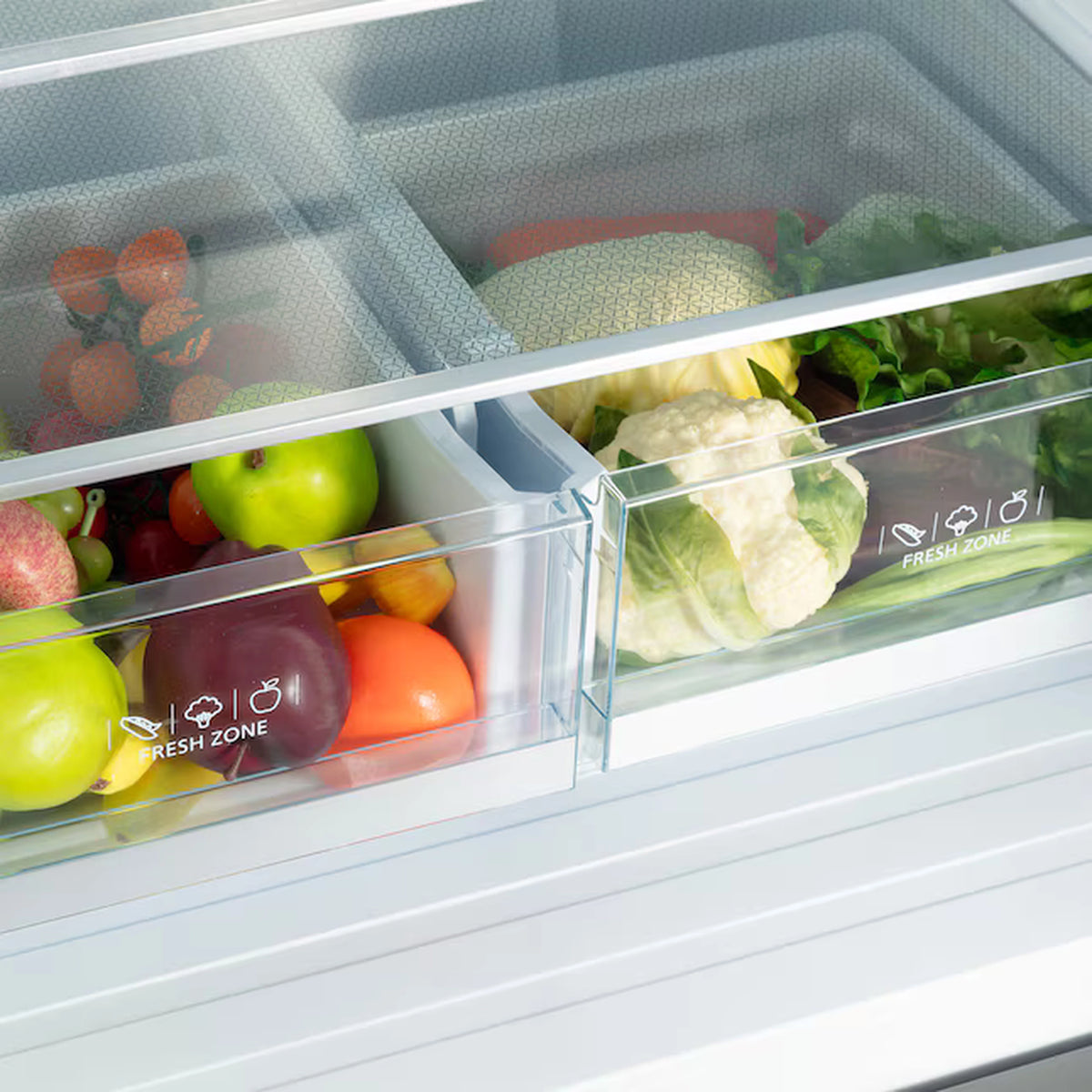 Stainless steel French door refrigerator interior with fresh food bins and vegetable drawers