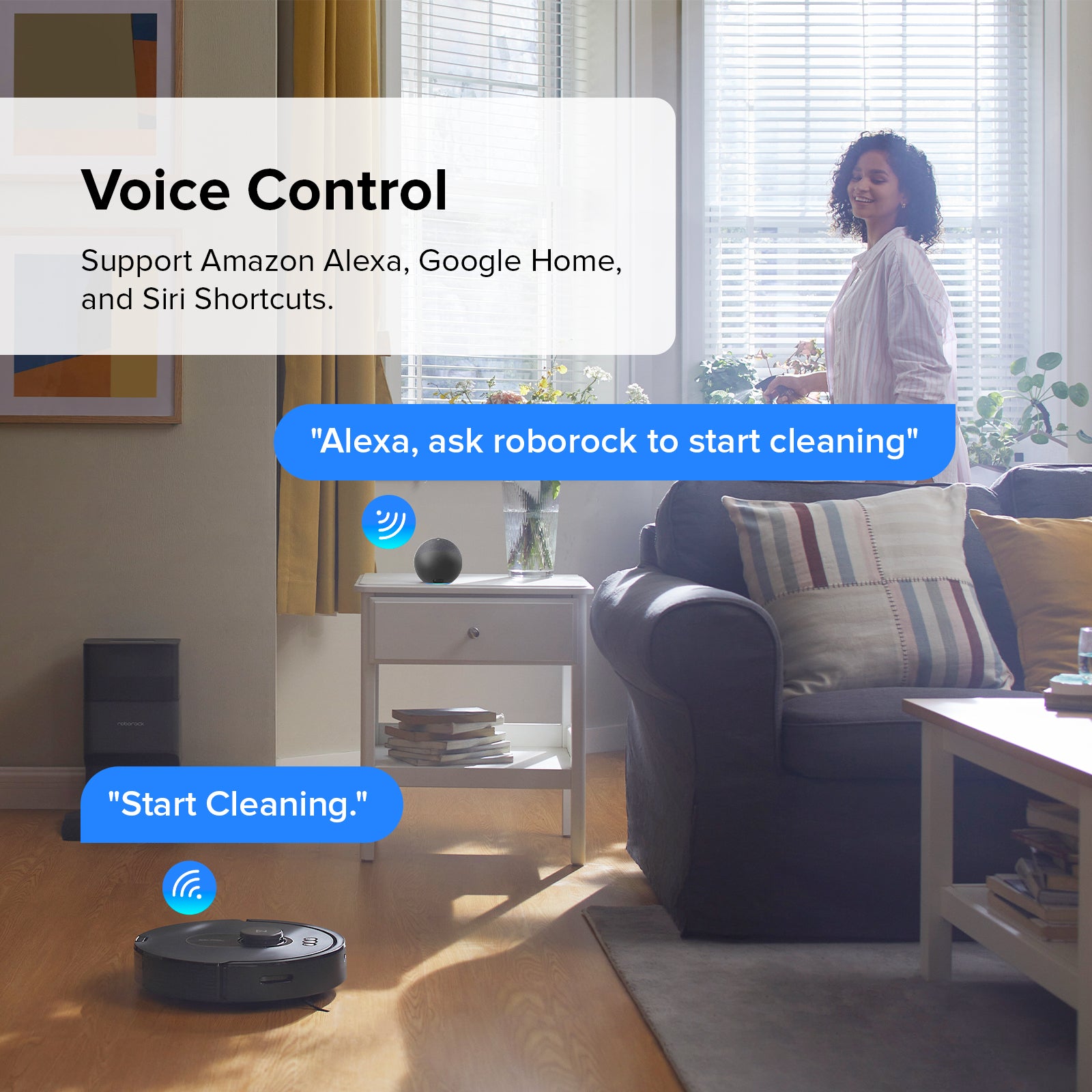Robot vacuum running in living room with voice control prompt on screen