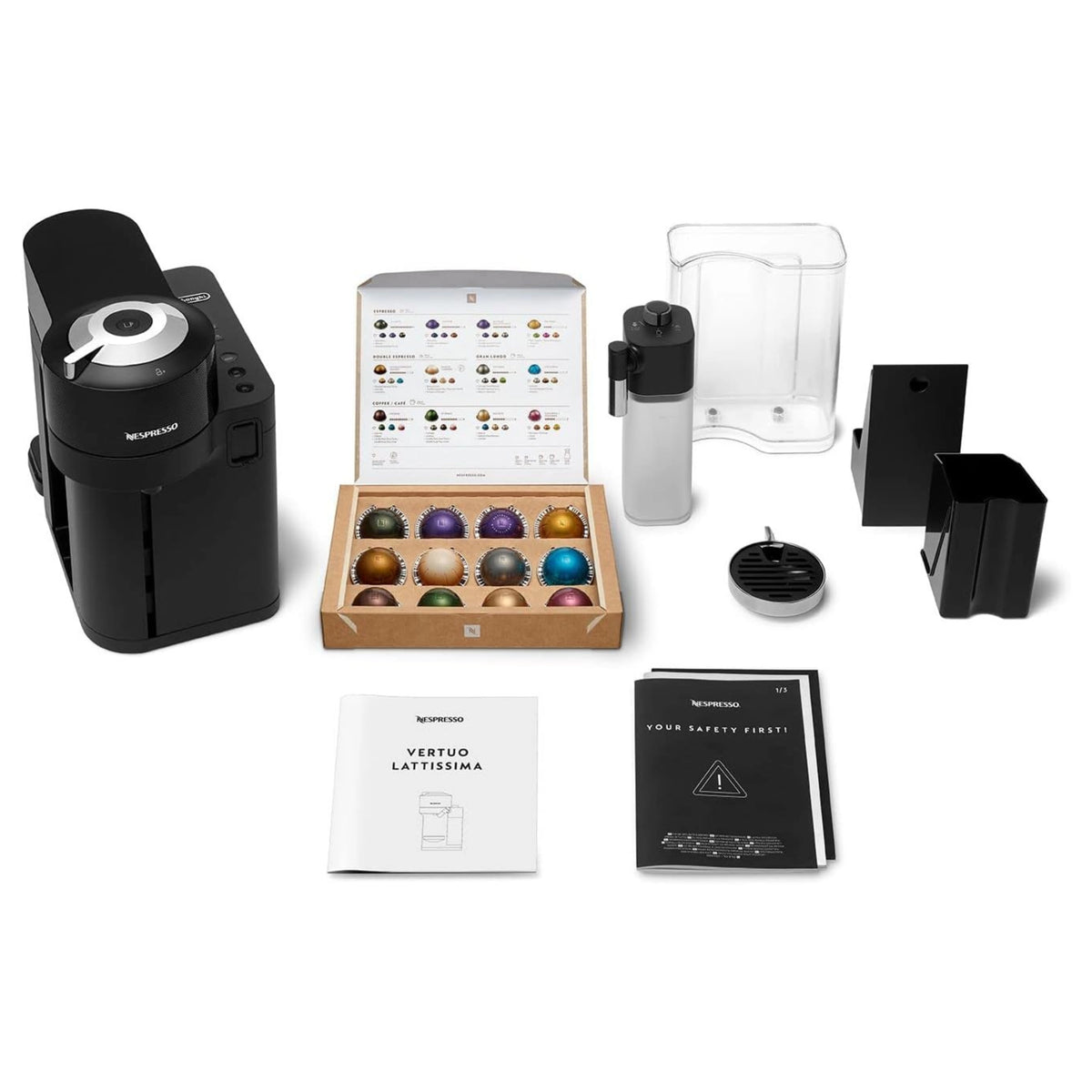 Black coffee machine with accessories, manuals, and milk container parts