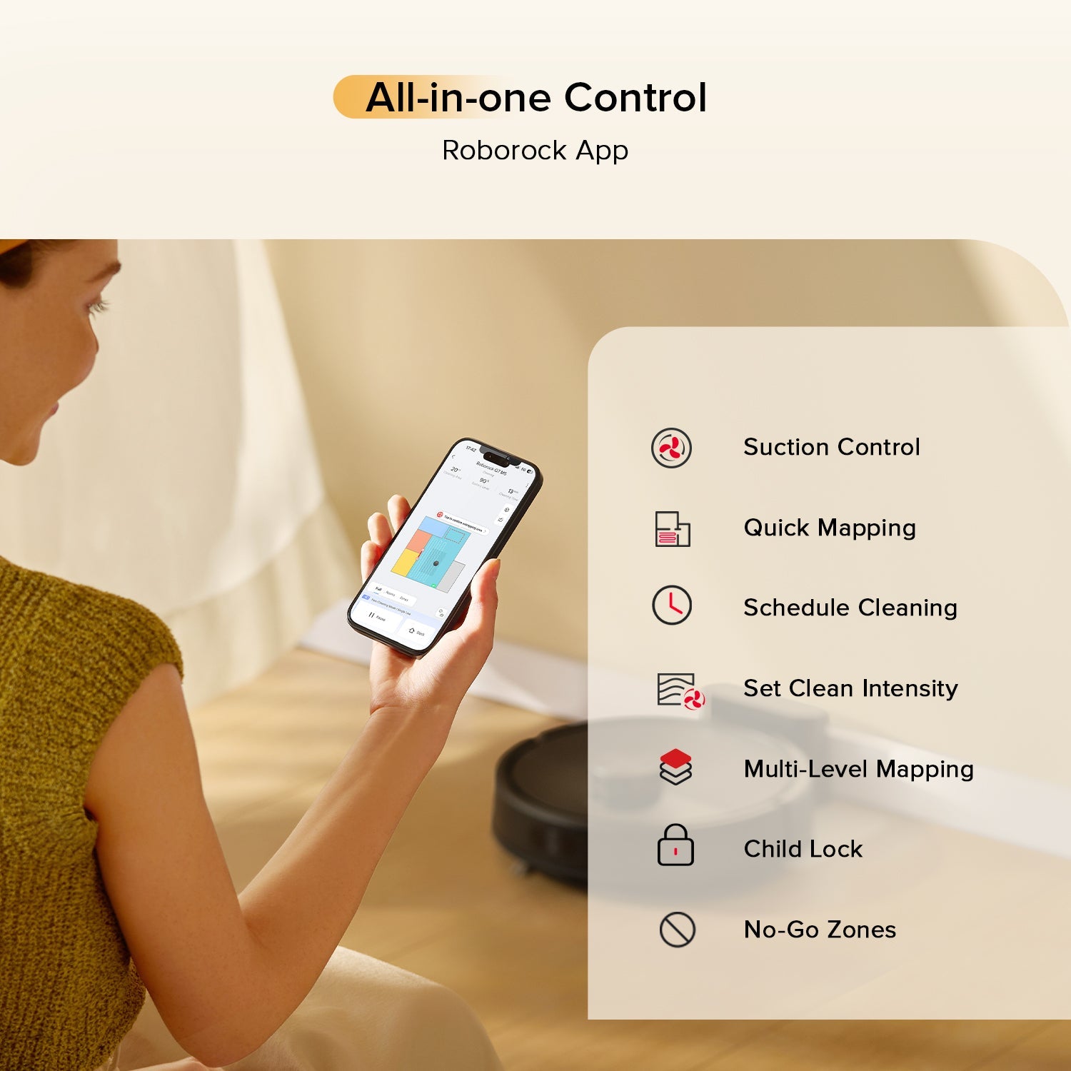 Black robot vacuum and mop with smartphone app control options displayed