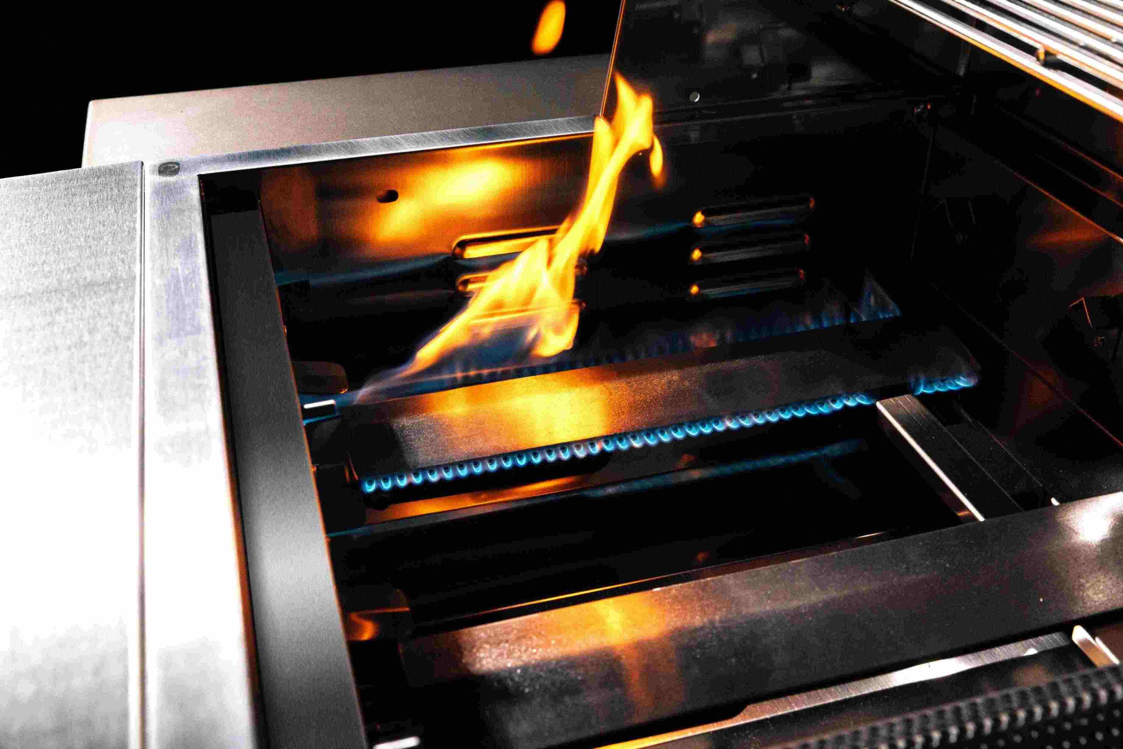 Built-in propane grill with active flame in the cooking chamber
