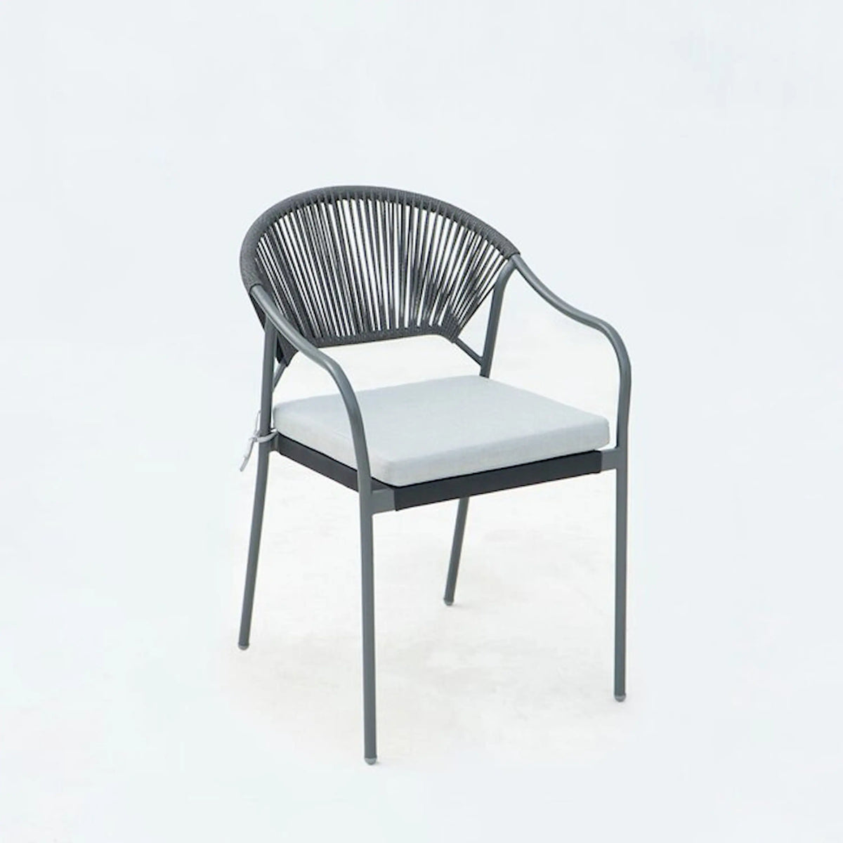 Outdoor patio dining chair with black rope back, white seat cushion, and metal legs.