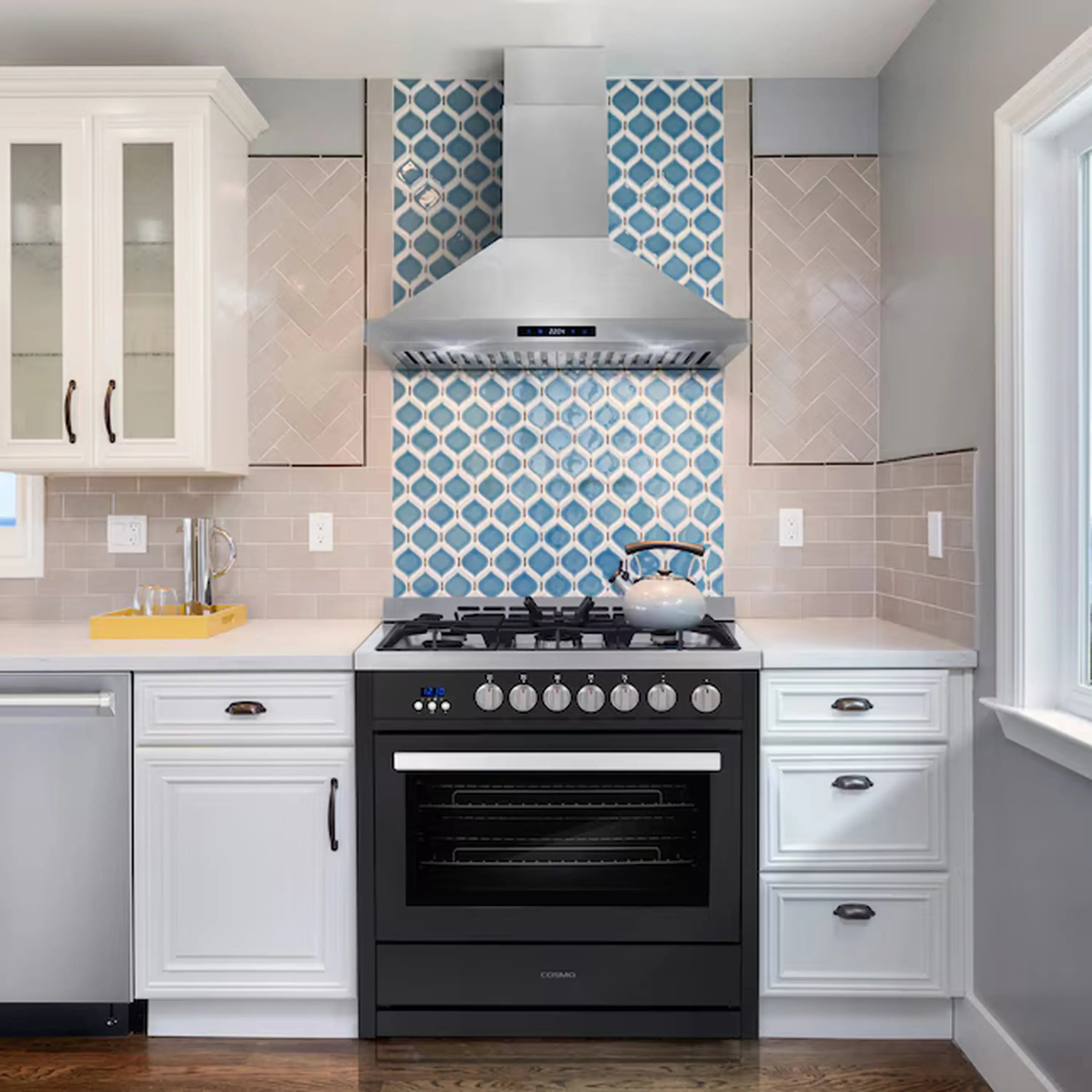 Matte black gas range in a kitchen with five-burner cooktop and oven door