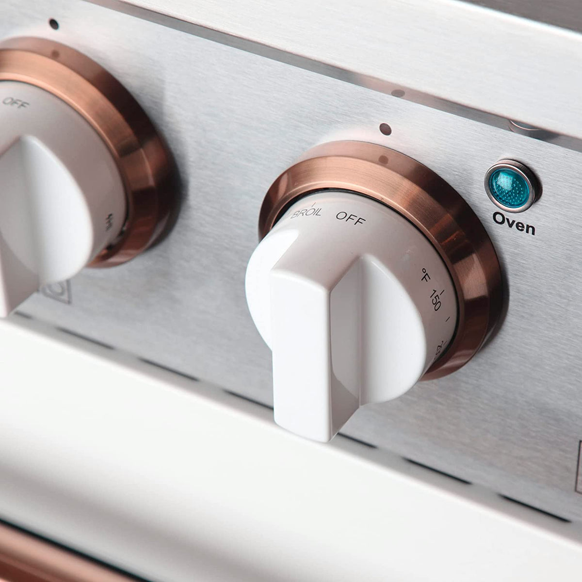 Kucht propane range control knob with rose gold bezel and stainless panel, labeled Oven