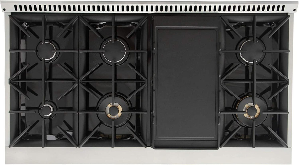 Open cooktop with black burner grates and closed center panel on Kucht range.