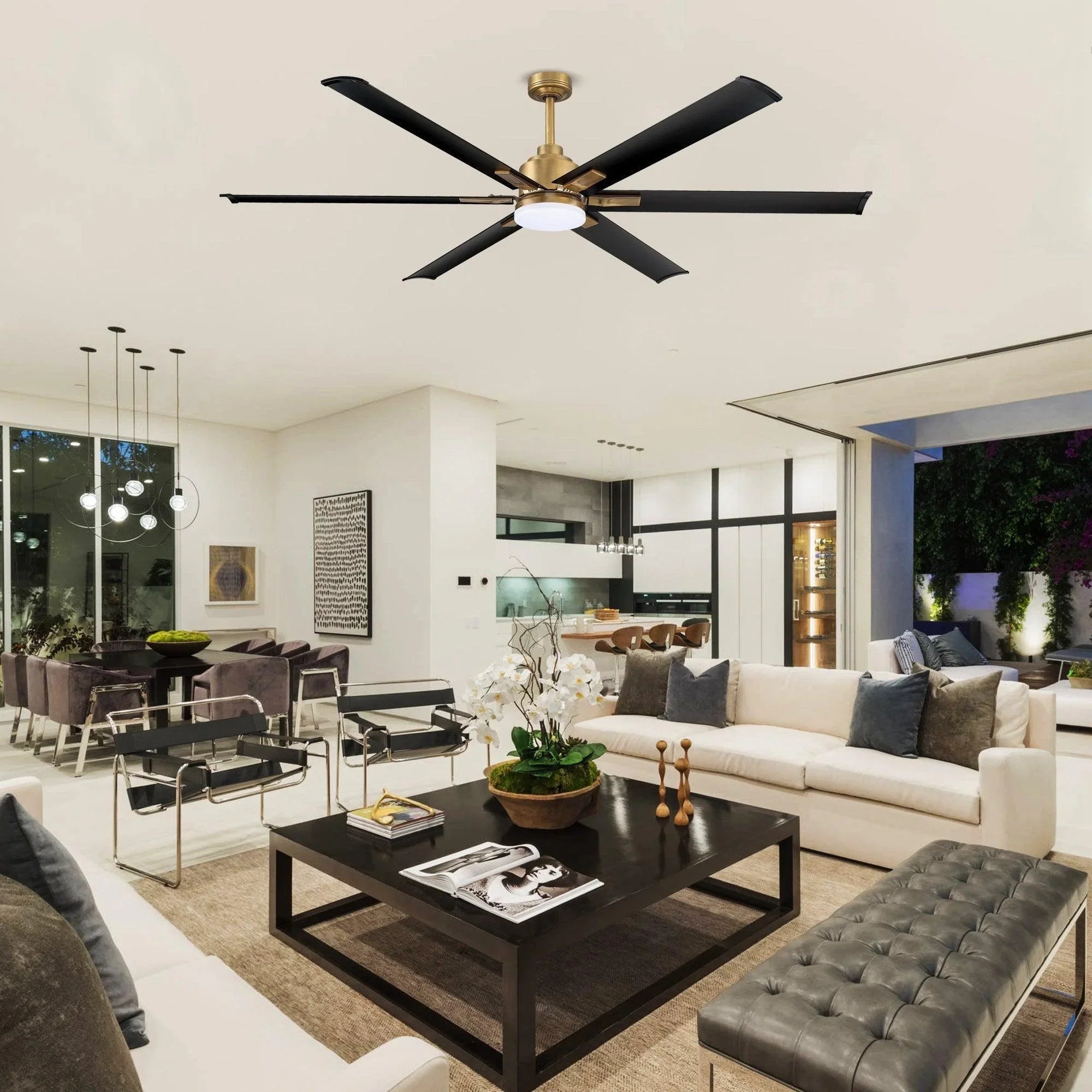 Ceiling fan with six black blades, gold downrod, and frosted round light fixture