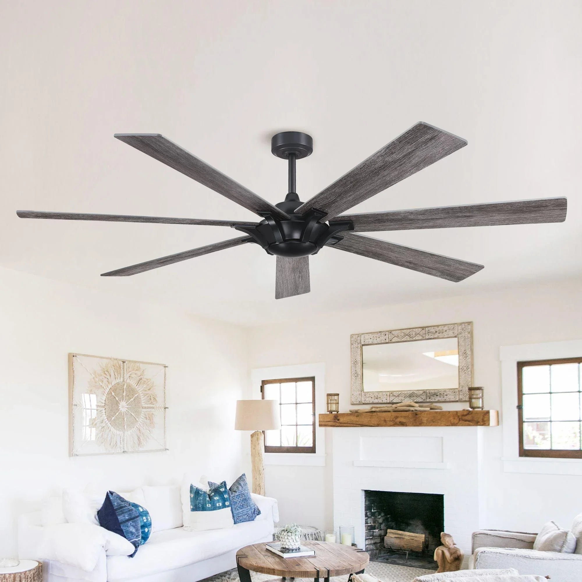 Black ceiling fan with gray wood-finish reversible blades on a ceiling mount