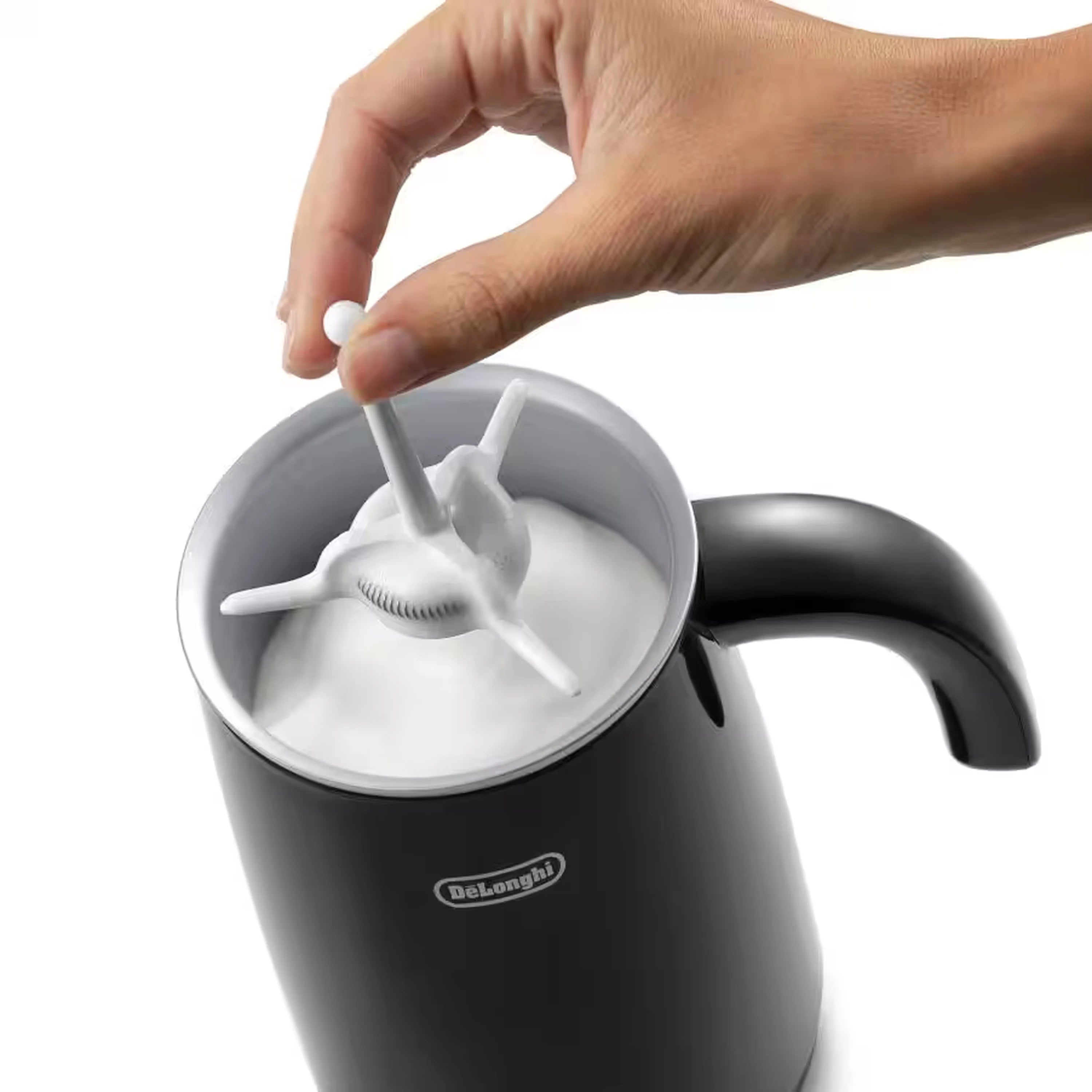 Black hot and cold milk frother with whisk attachment in frothing cup