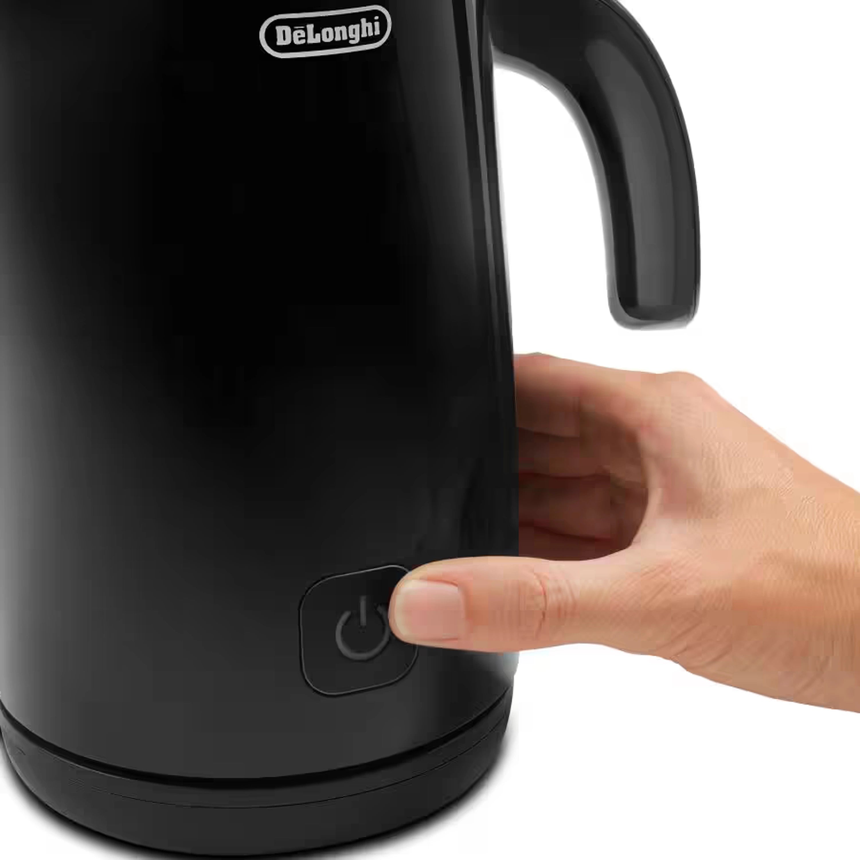 Black milk frother base with power button, hand holding the handle
