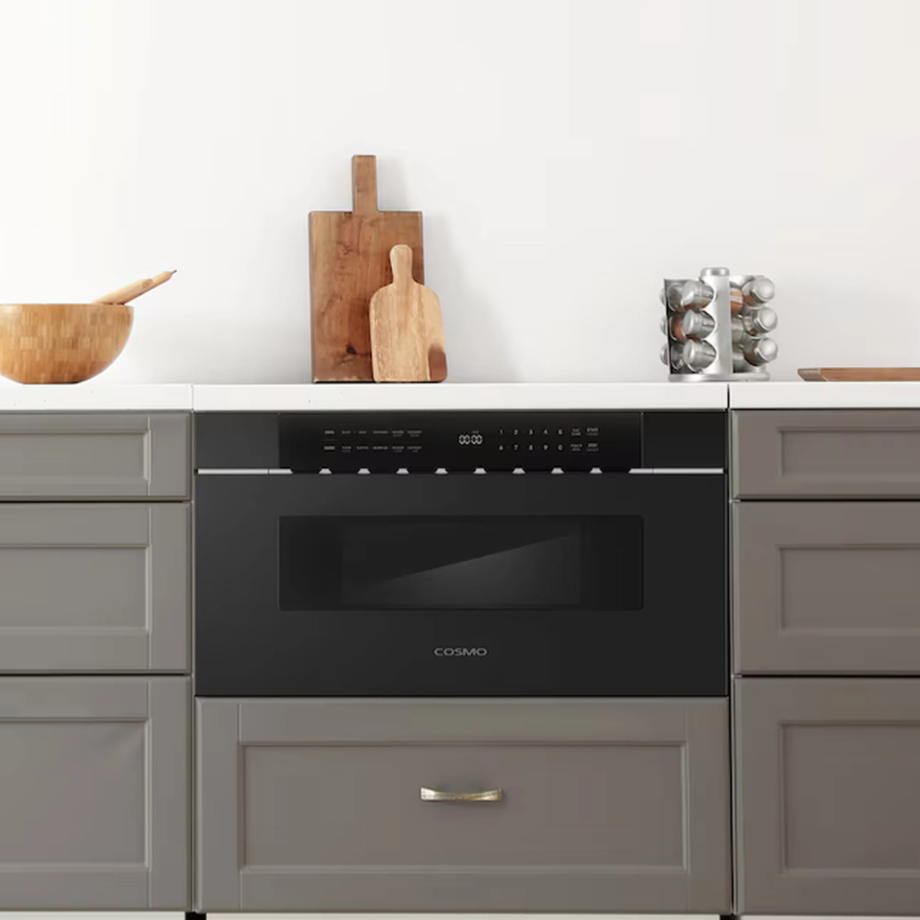 Matte black built-in microwave drawer with dark glass door and handle