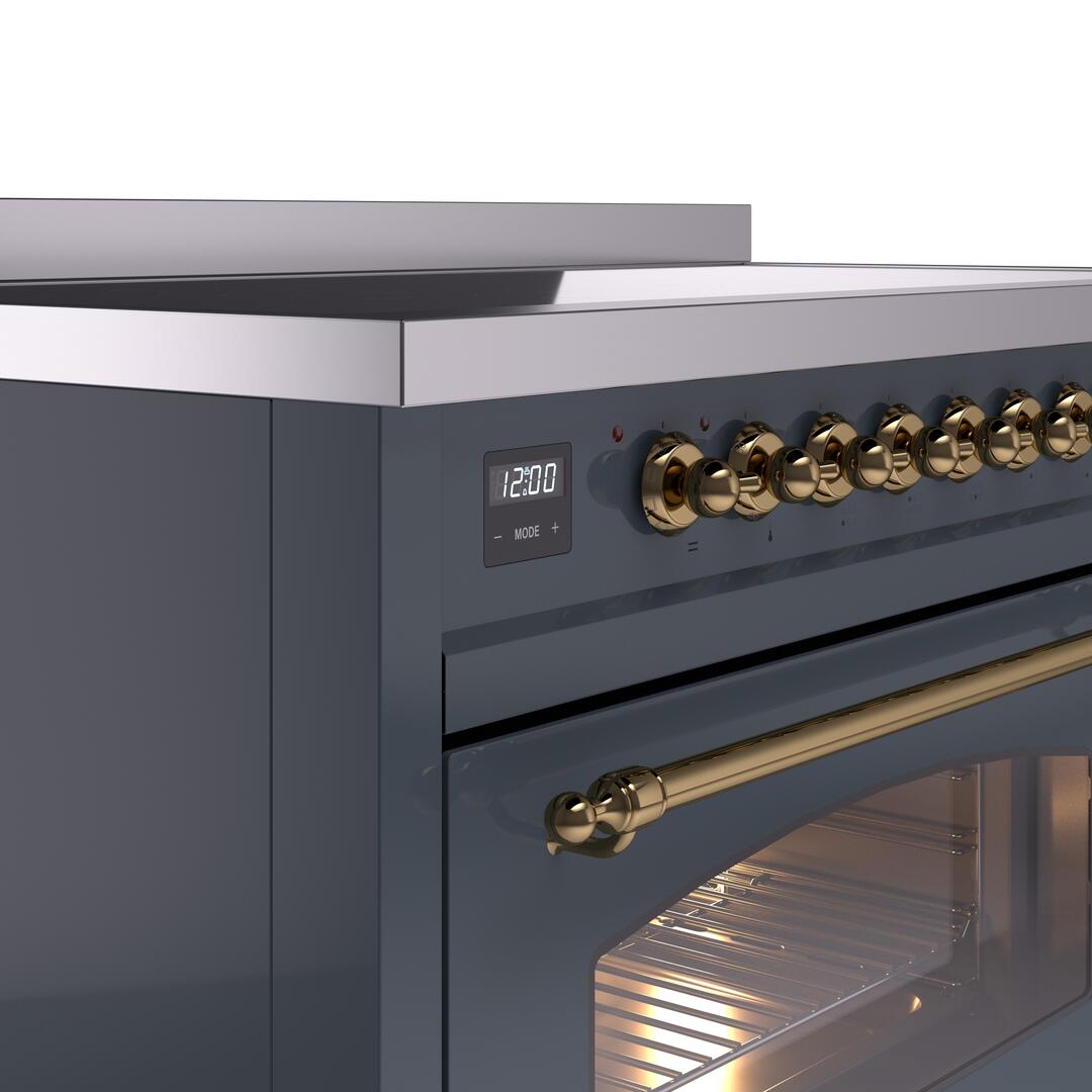 Control panel of a blue-grey induction range with brass knobs and digital display