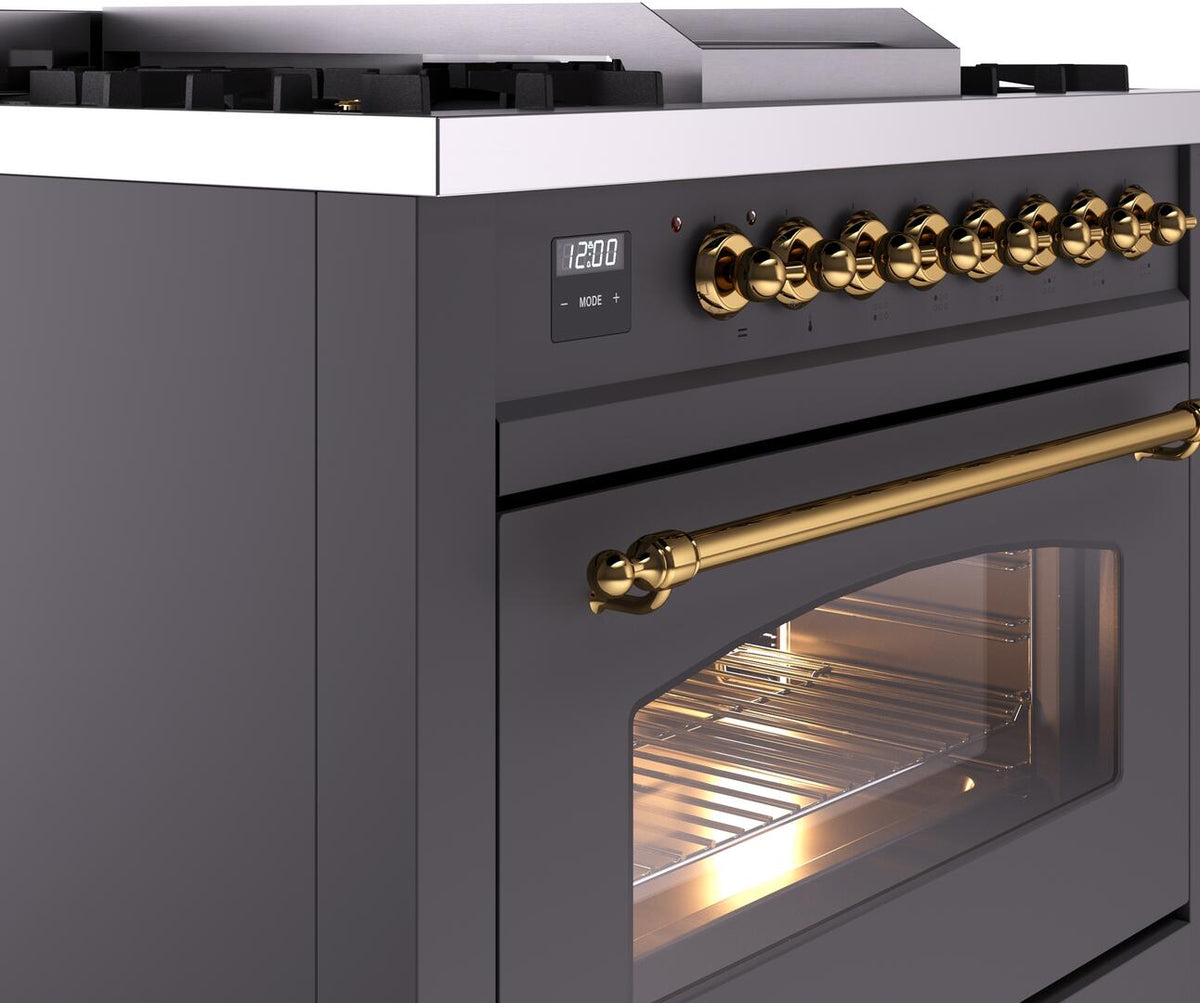 Matte graphite dual fuel range side view with brass handle and lit oven interior