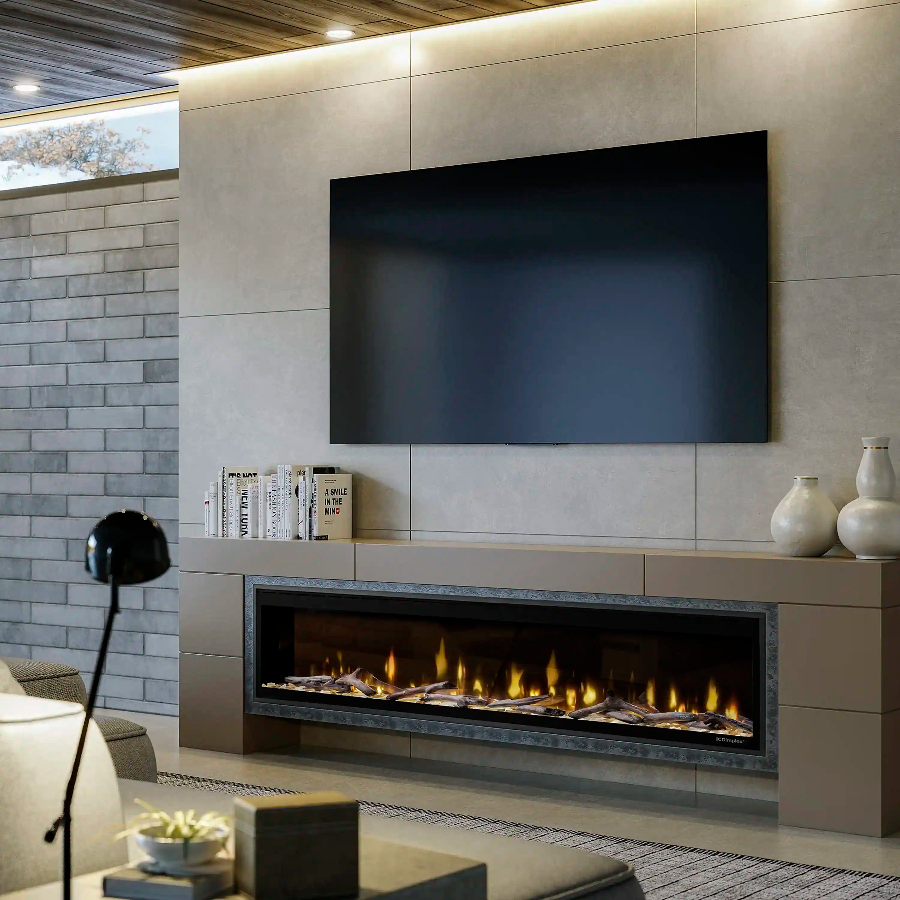 Built-in linear electric fireplace with glowing flame bed in a wall surround