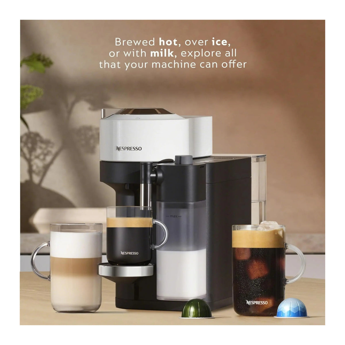 White and black coffee machine with glass carafe and three coffee cups