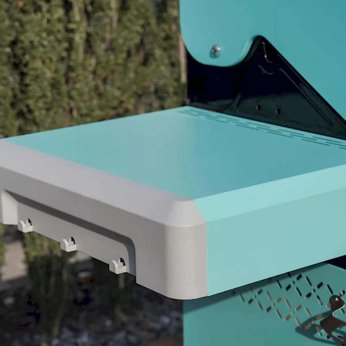 Green powder-coated grill lid with side shelf and control panel support