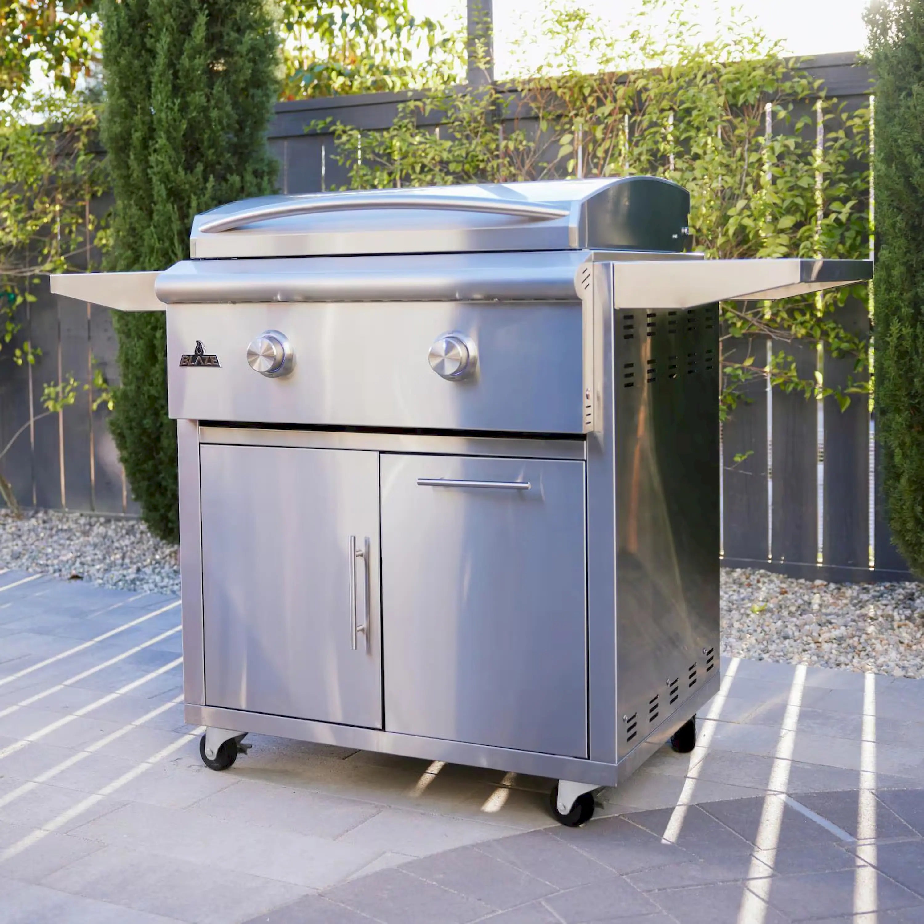 Outdoor stainless steel freestanding grill with side shelves, two burner knobs
