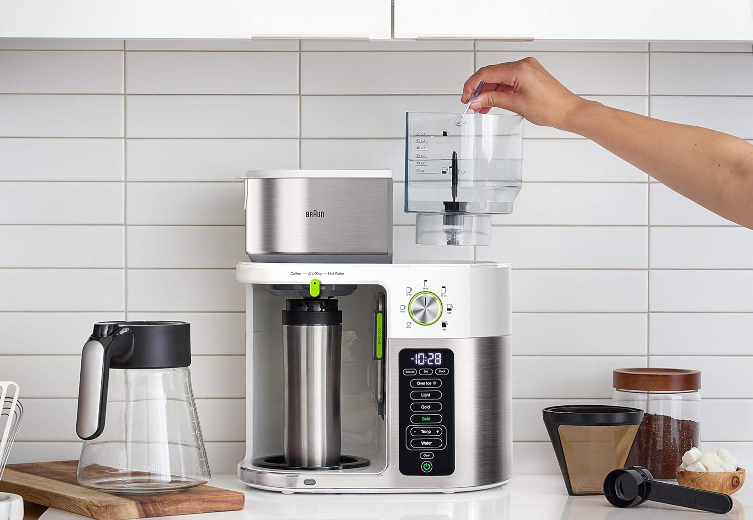 Stainless steel and white coffee maker with glass carafe and hand loading top reservoir