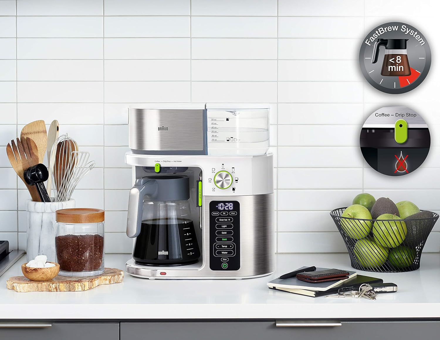 Compact stainless steel and white coffee brewing system on countertop with carafe