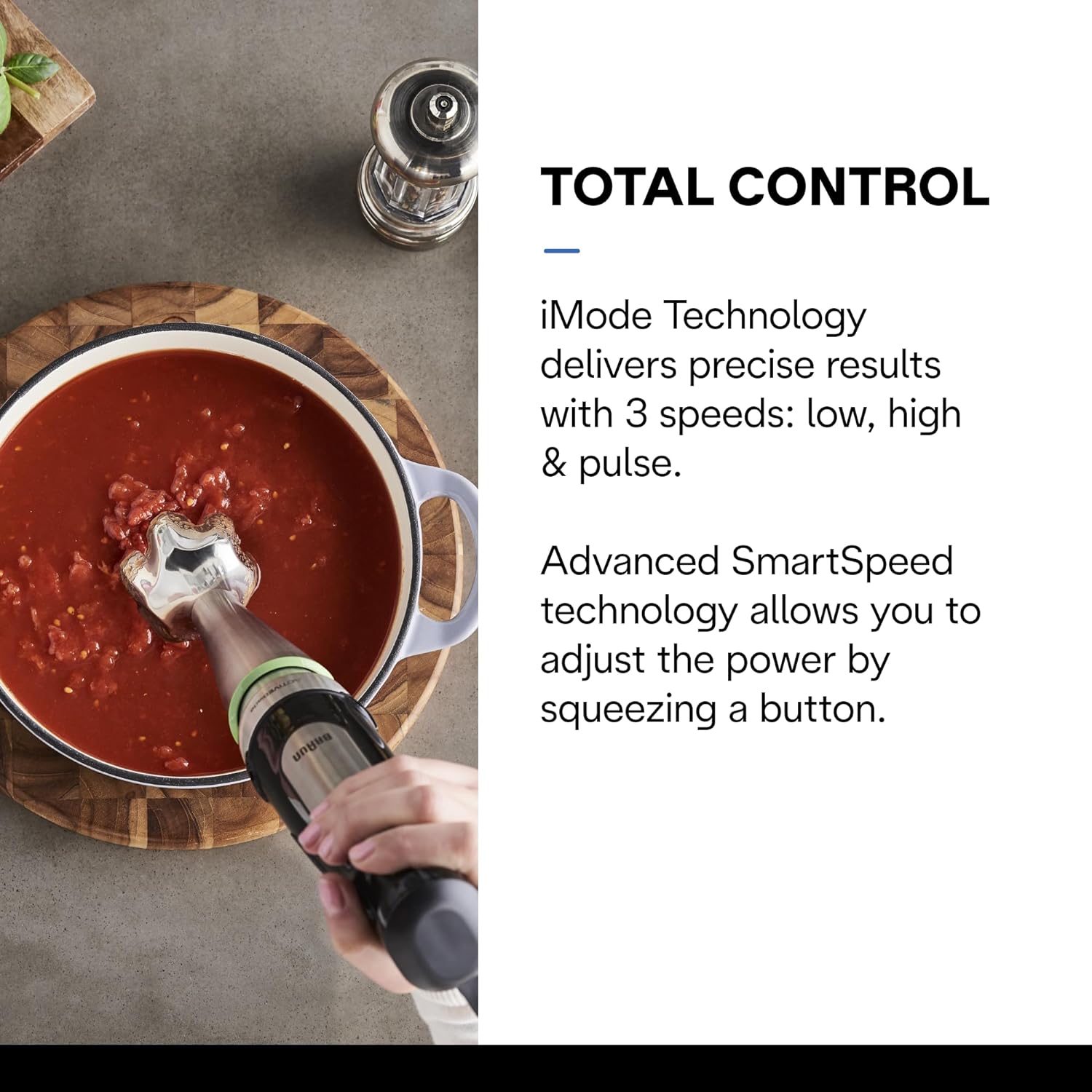Braun hand blender blending sauce in a pot with the blending head inserted.
