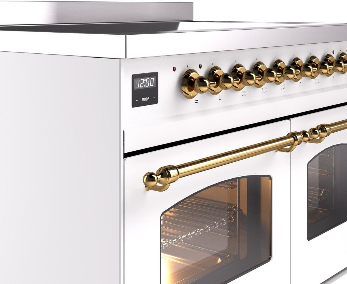 Brass knobs and control panel detail on a white freestanding induction range
