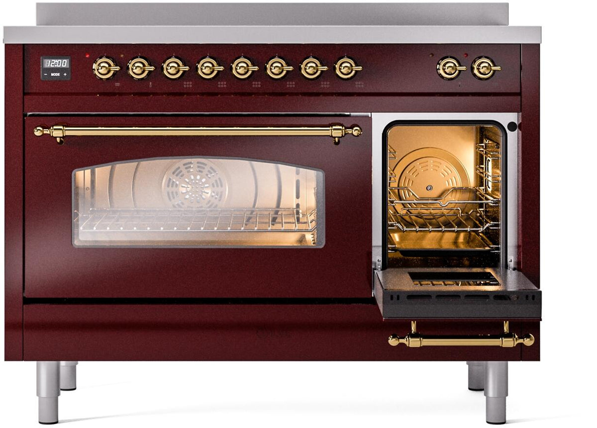Freestanding electric induction range in burgundy with brass trim and open side oven door