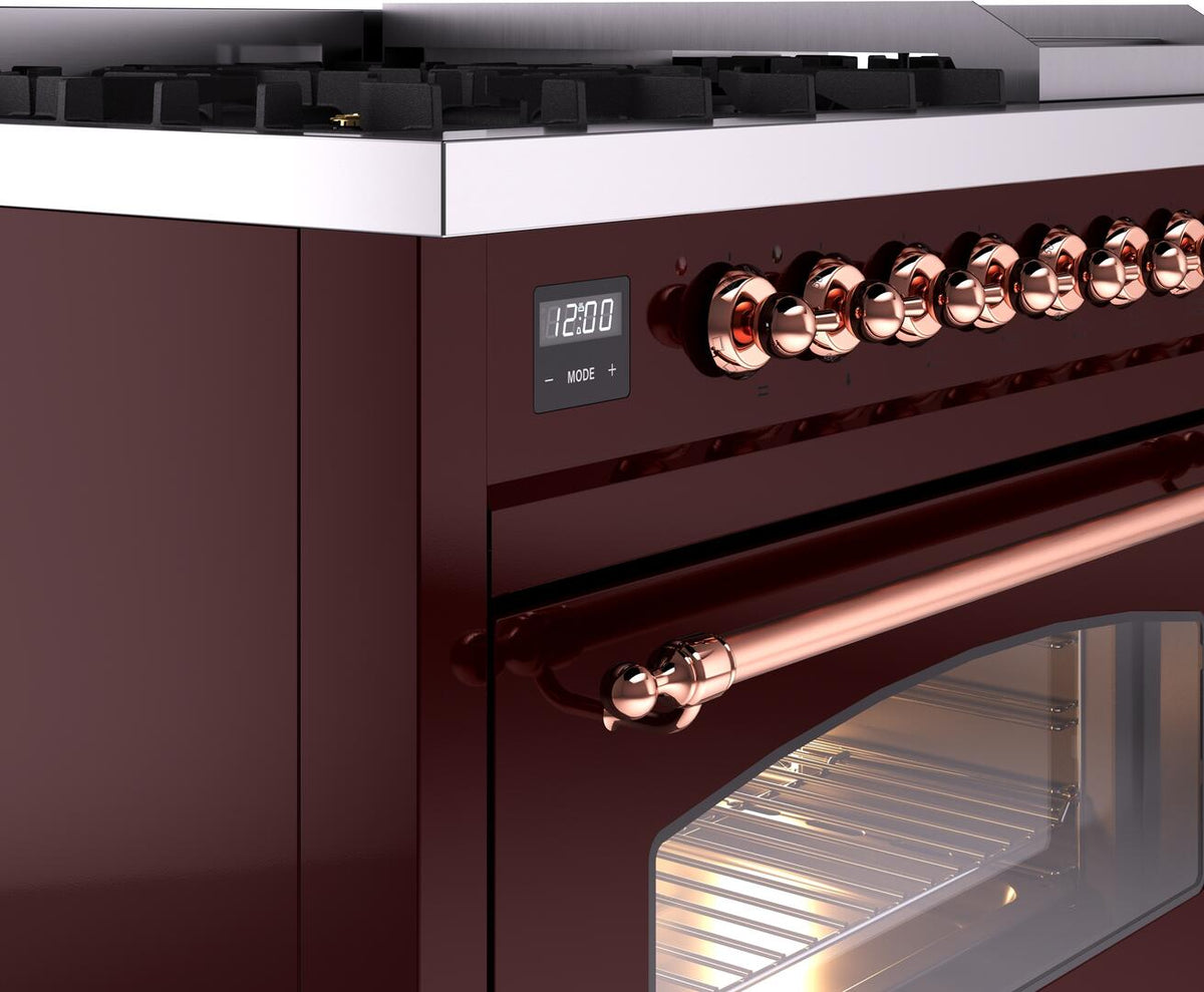 Burgundy dual-fuel freestanding range with copper control knobs and display