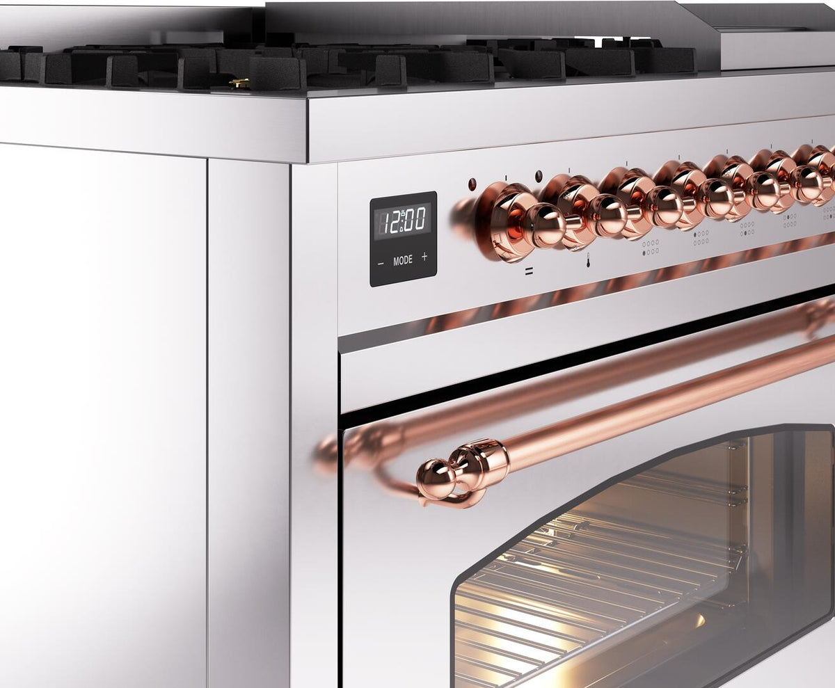 Range side control area with copper-colored knobs and glass oven door