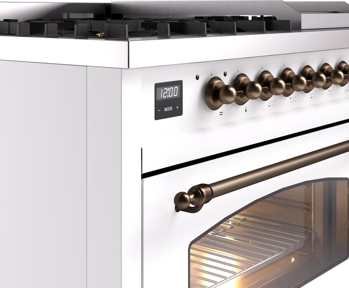 Freestanding dual fuel range control panel with bronze knobs and front handle trim