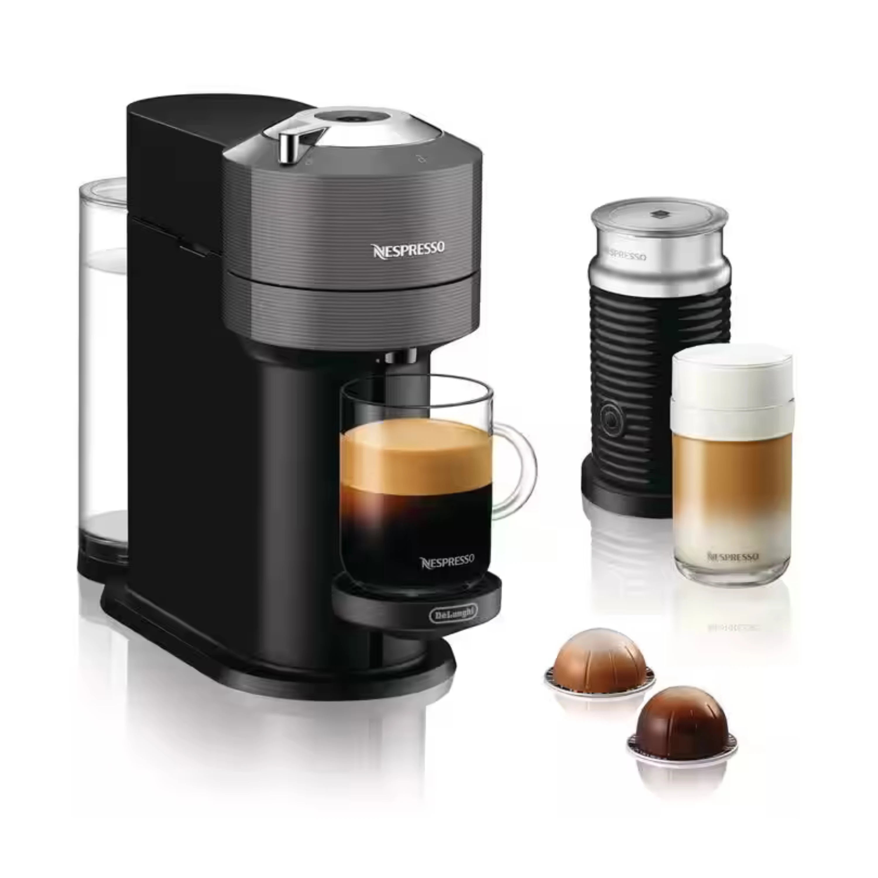 Black and gray Nespresso coffee maker with milk frother and espresso cups