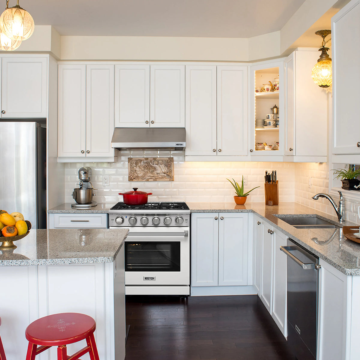 White propane gas range with 5 burners installed in kitchen, oven closed.