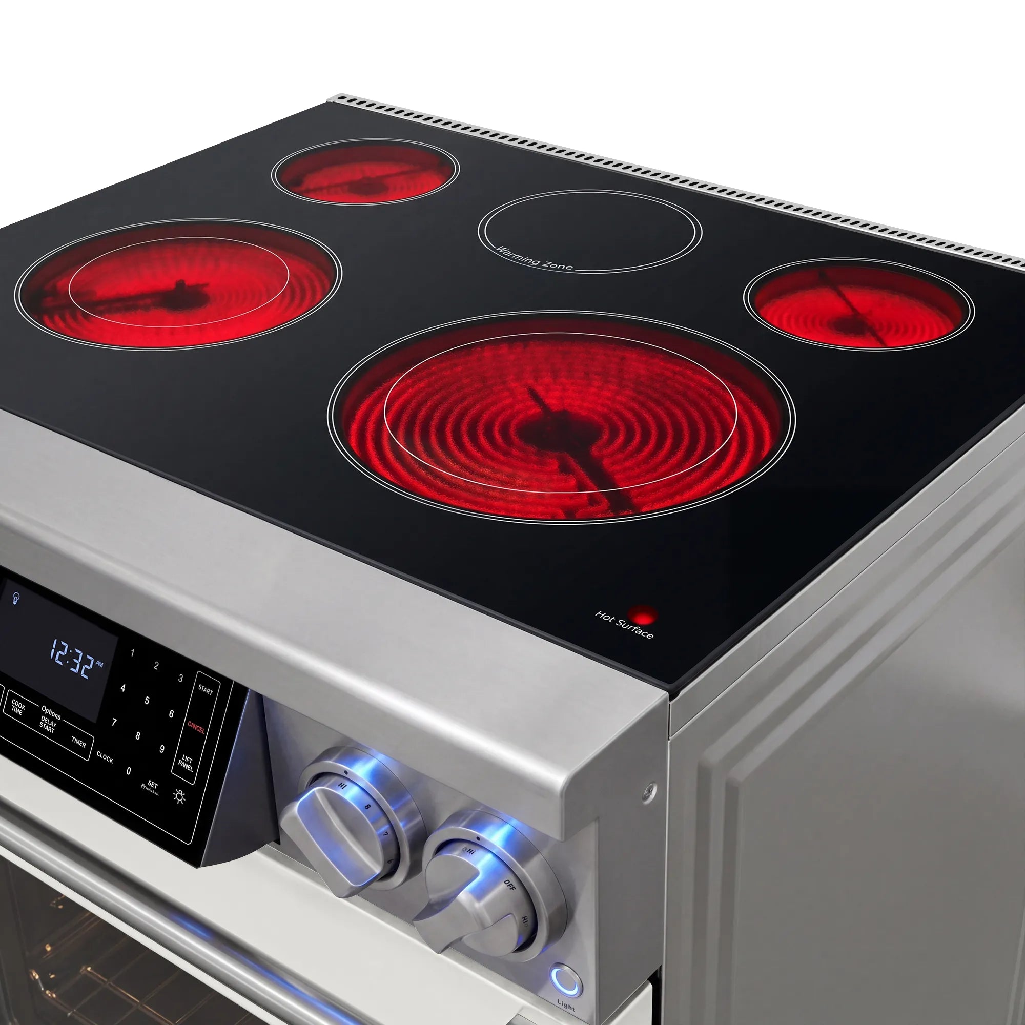 Black glass cooktop on electric range with four glowing red heating elements