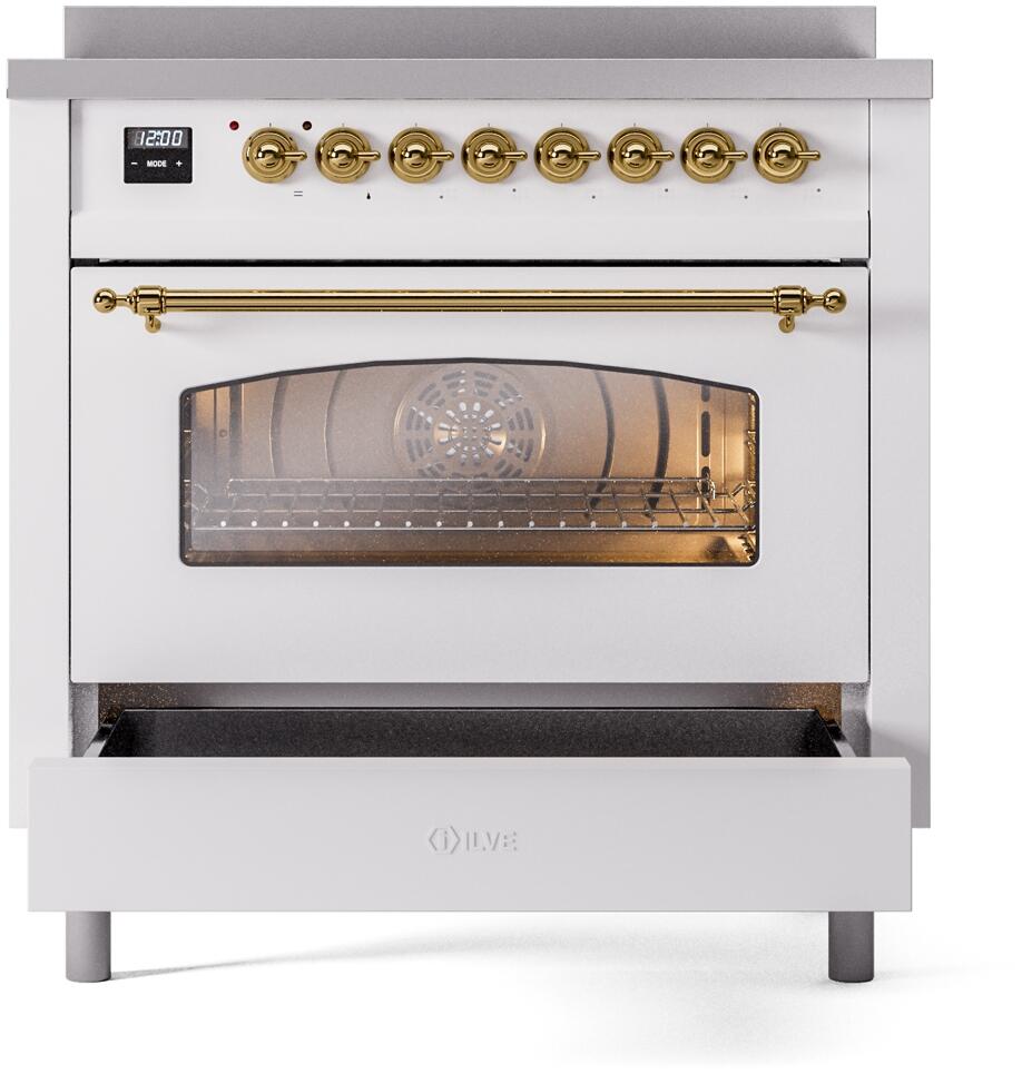 White induction range front with brass control knobs, oven door window, and drawer