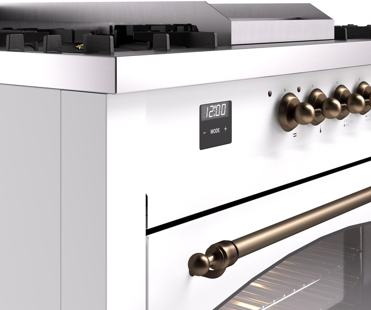 White dual fuel gas range control panel detail with bronze knobs and display lights