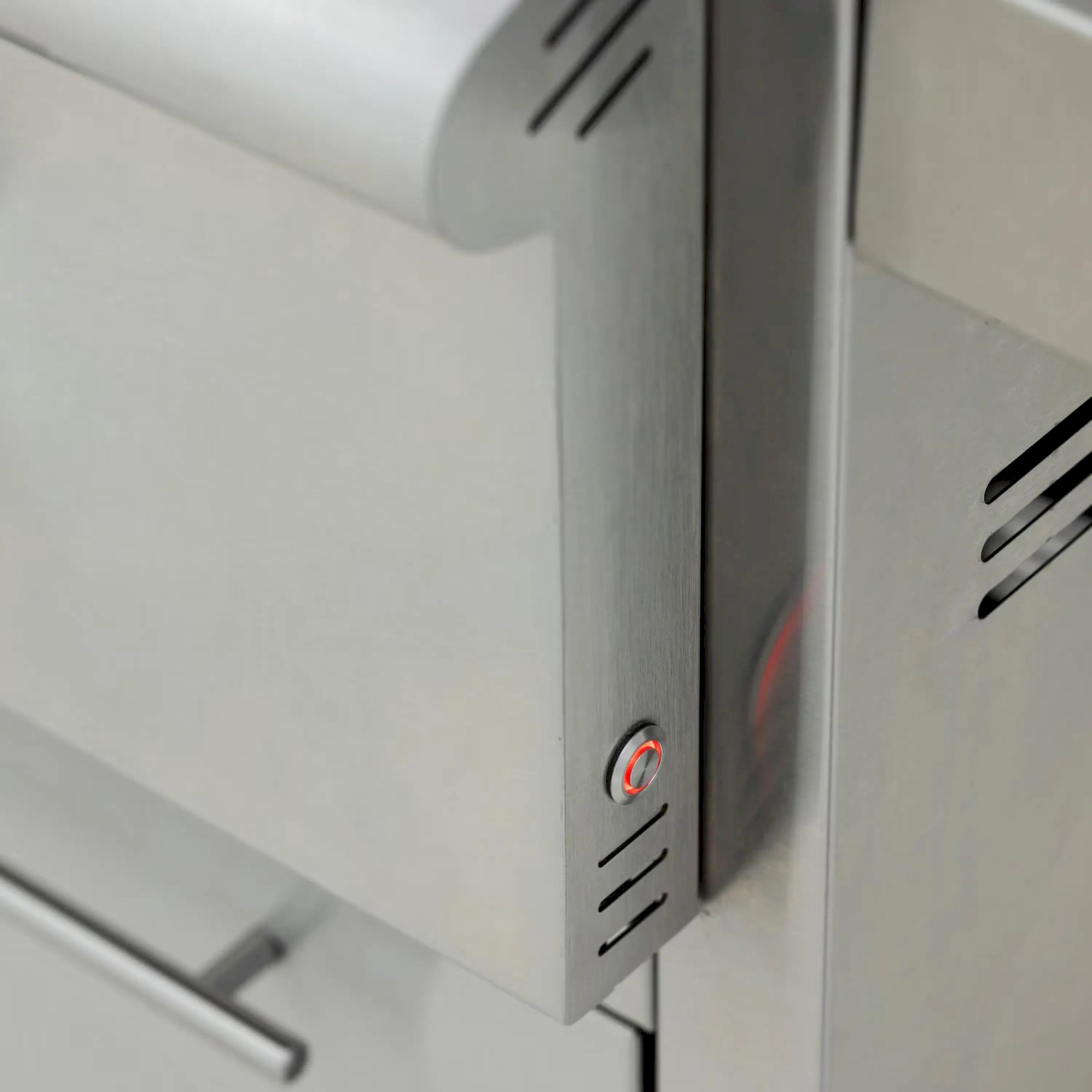 Stainless steel control panel with ignition button and red indicator light