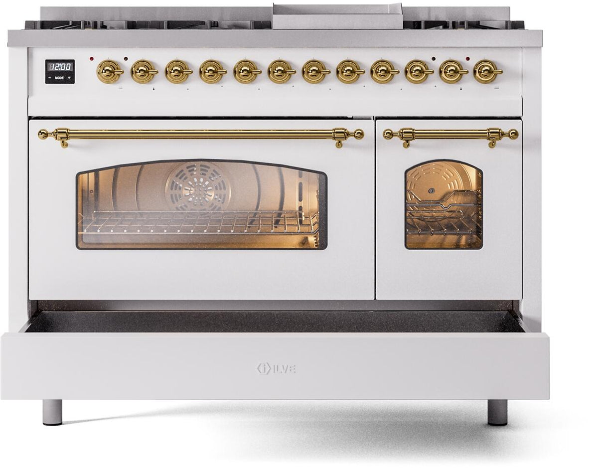 White dual fuel range with brass trim, open main oven and small oven door, visible burners.