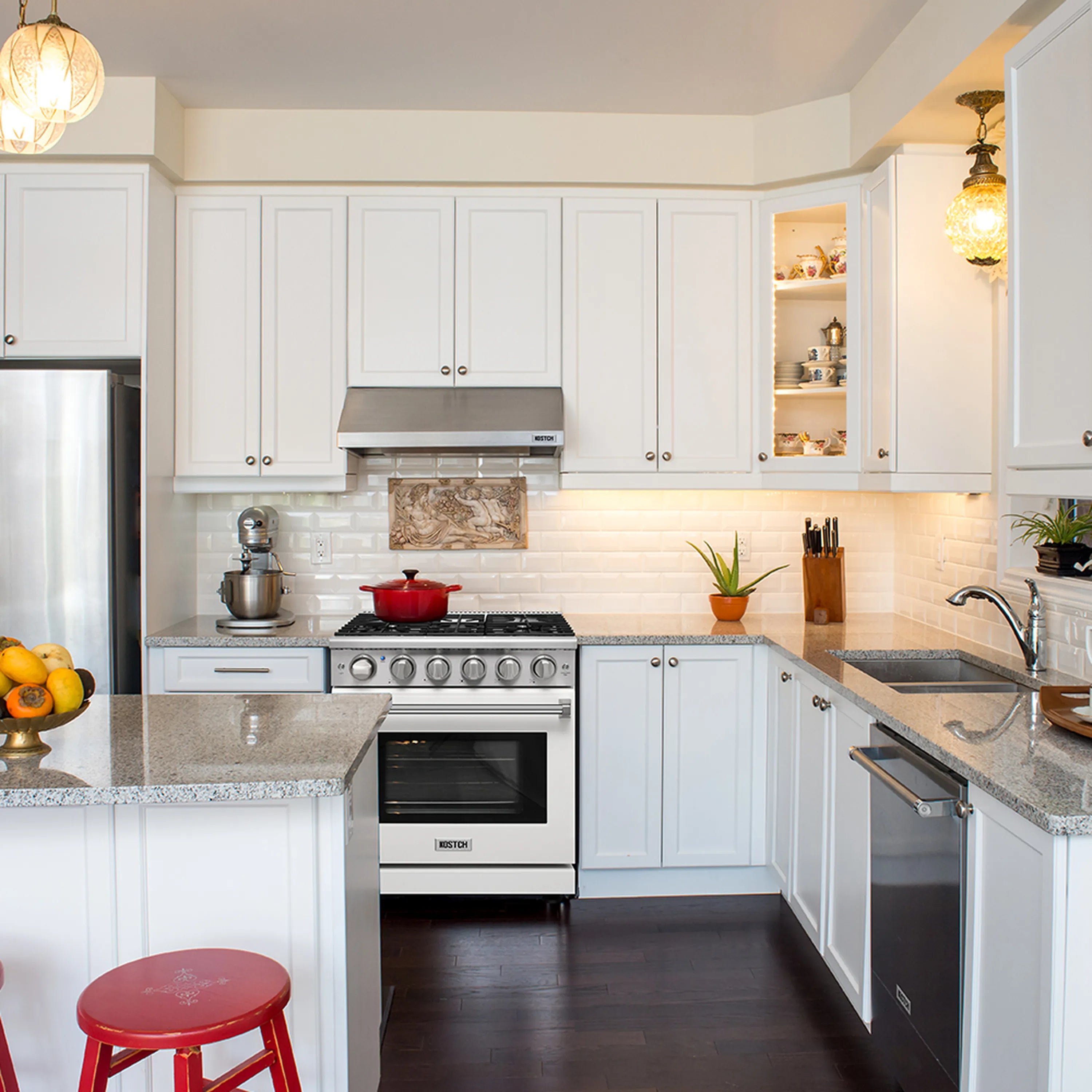White 30-inch gas range in a kitchen with oven door closed and control panel visible