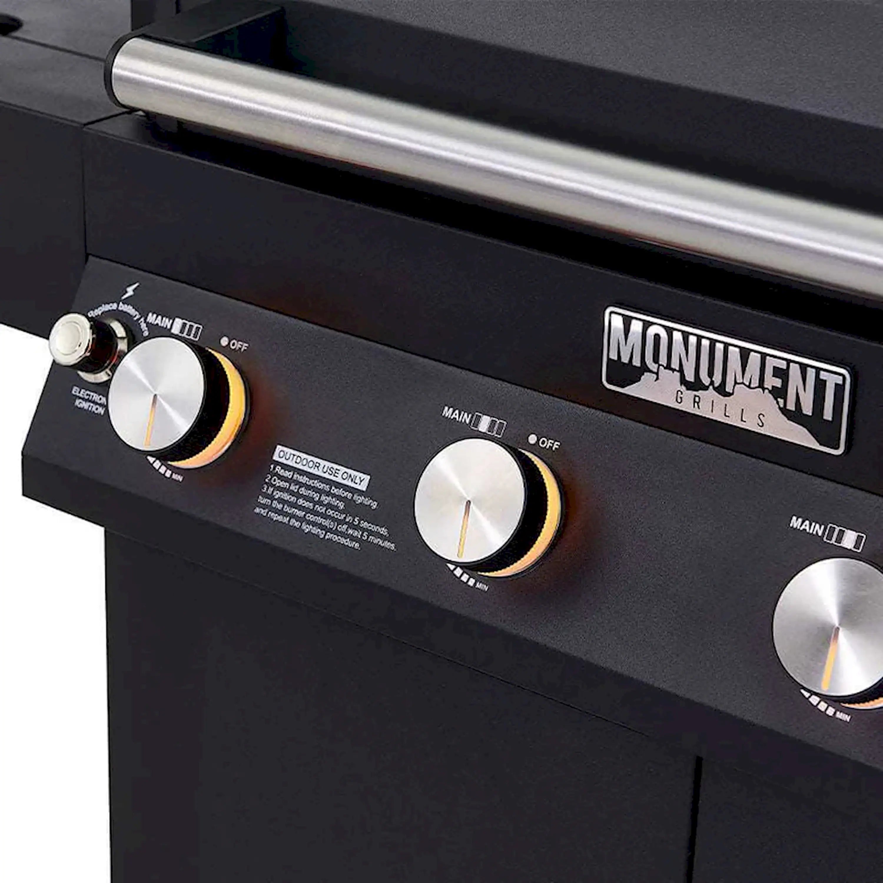 Black grill front panel with burner knob controls and Monument Grills label